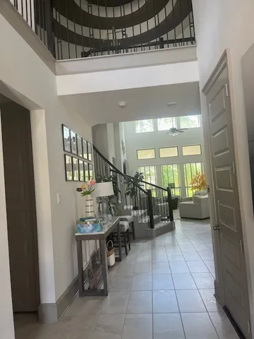 a lobby with furniture and stairs