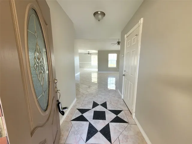 a bathroom with a glass door shower and a sink