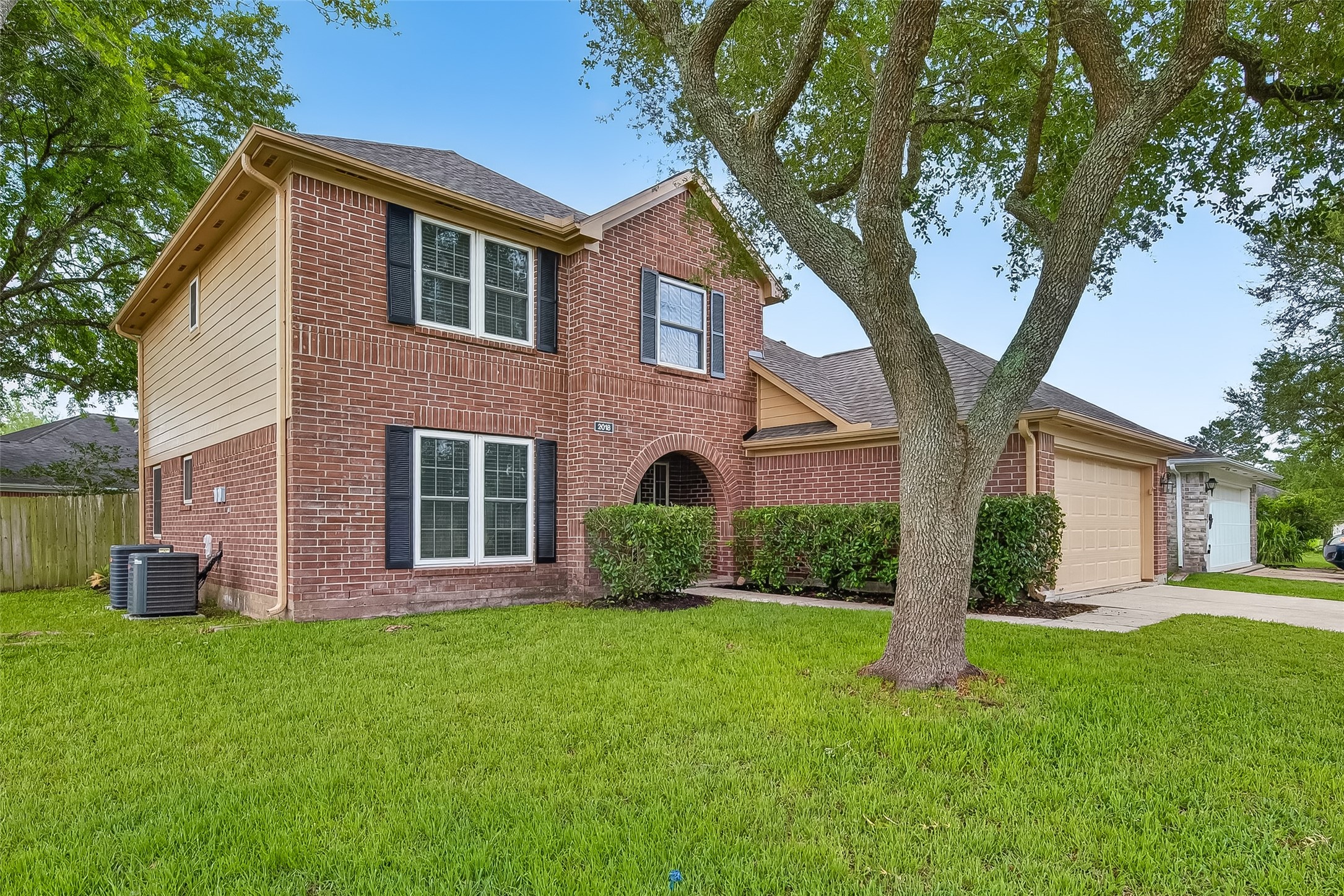 2018 Village Ct Lane Rosenberg, TX 77471 - Photo 2 of 50 a front view of house with yard and green space