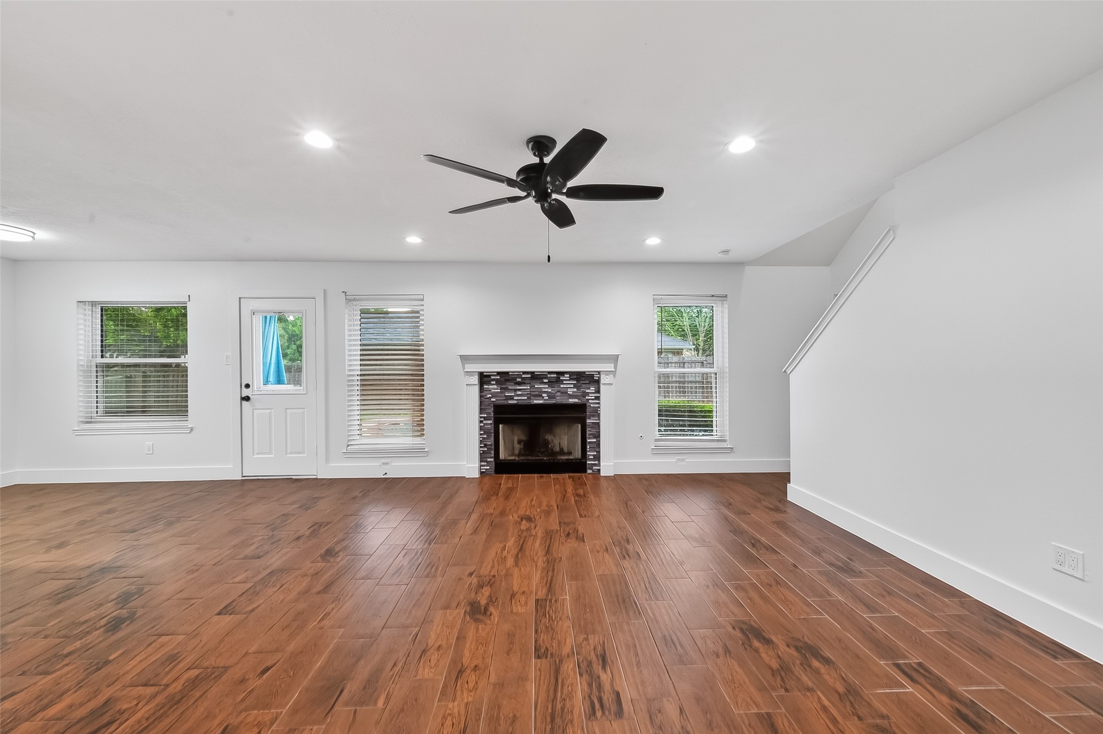 2018 Village Ct Lane Rosenberg, TX 77471 - Photo 23 of 50 a view of an empty room with a fireplace and a window