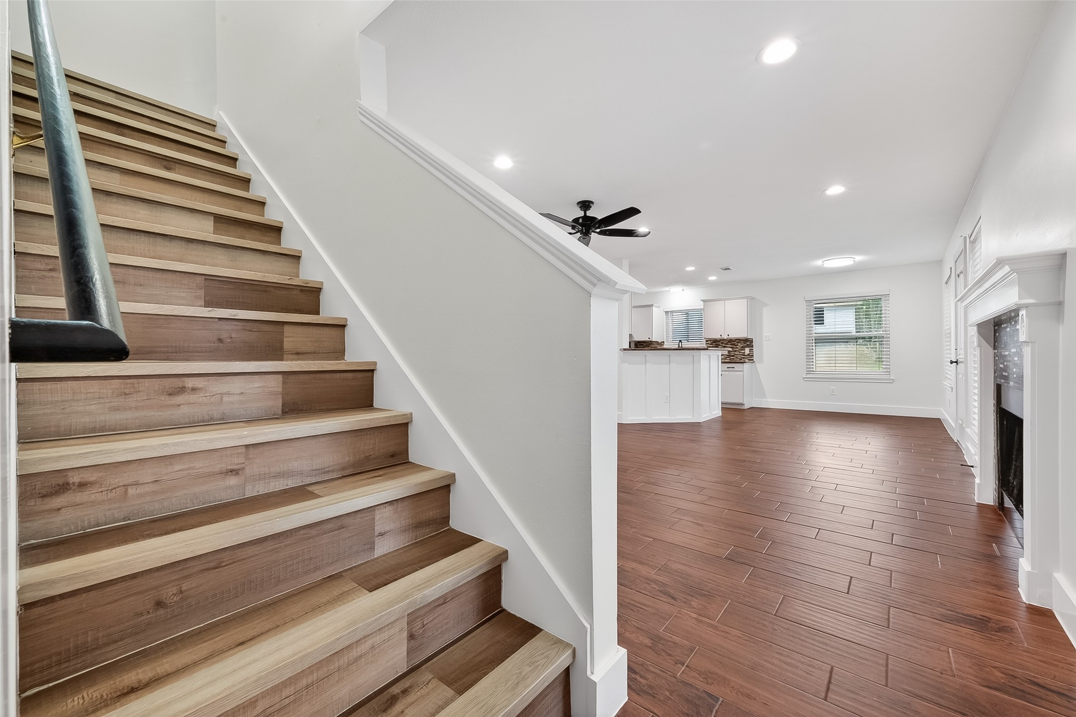2018 Village Ct Lane Rosenberg, TX 77471 - Photo 27 of 50 a view of kitchen and hall with wooden floor