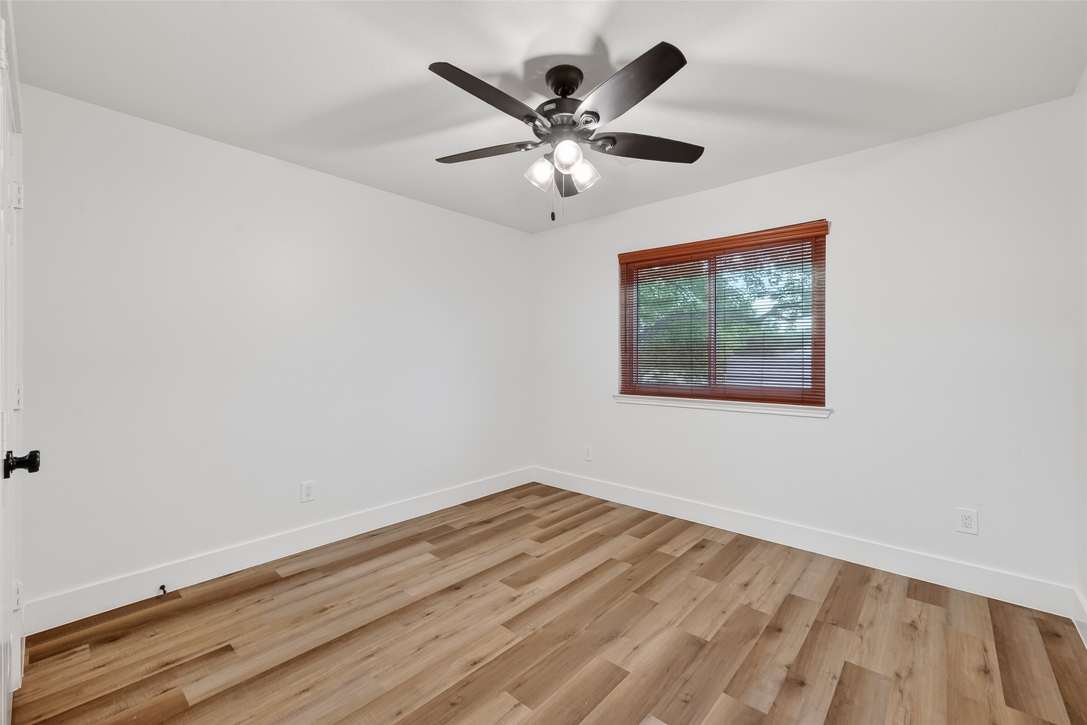 2018 Village Ct Lane Rosenberg, TX 77471 - Photo 30 of 50 a view of an empty room with wooden floor