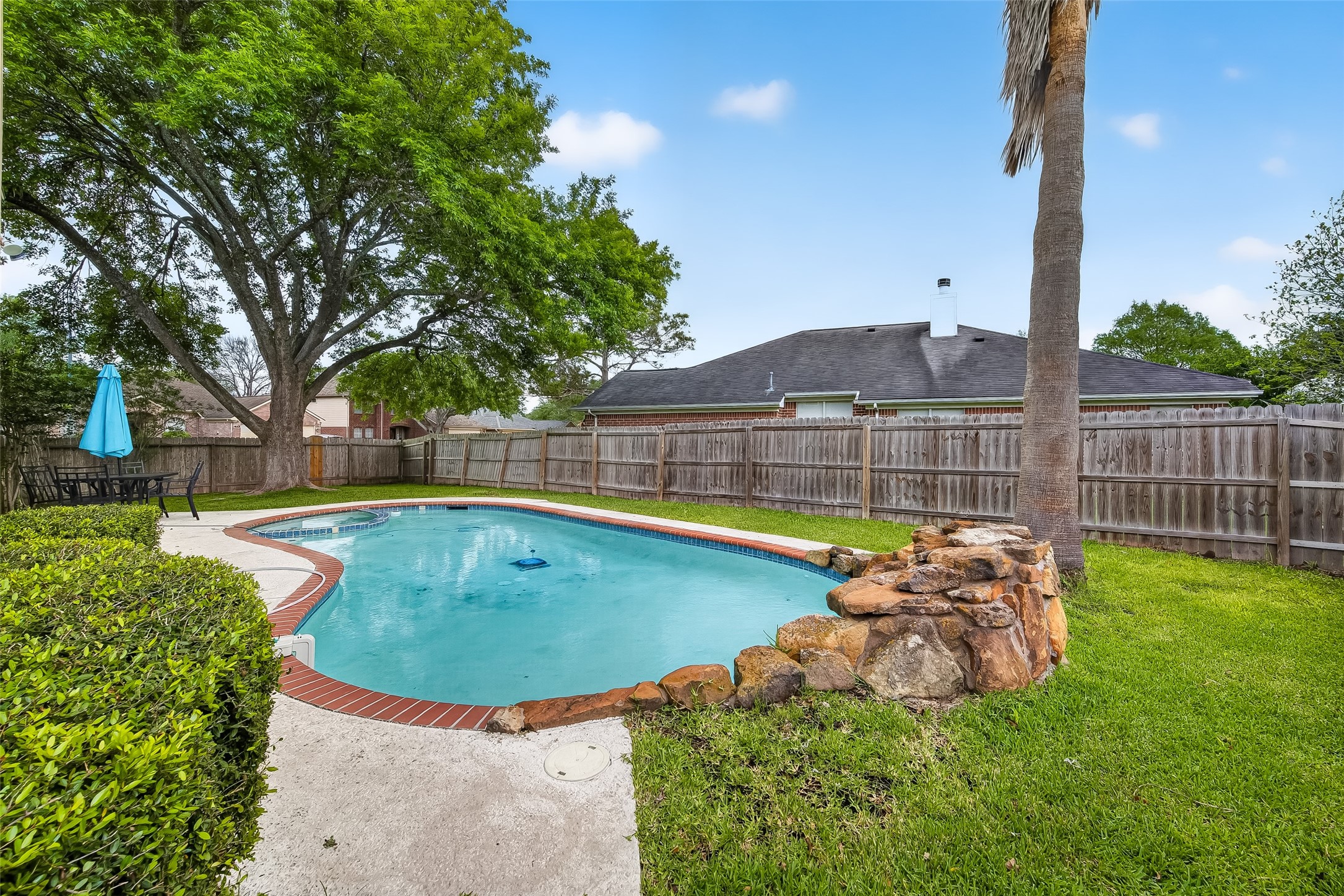 2018 Village Ct Lane Rosenberg, TX 77471 - Photo 3 of 50 a view of a backyard with swimming pool