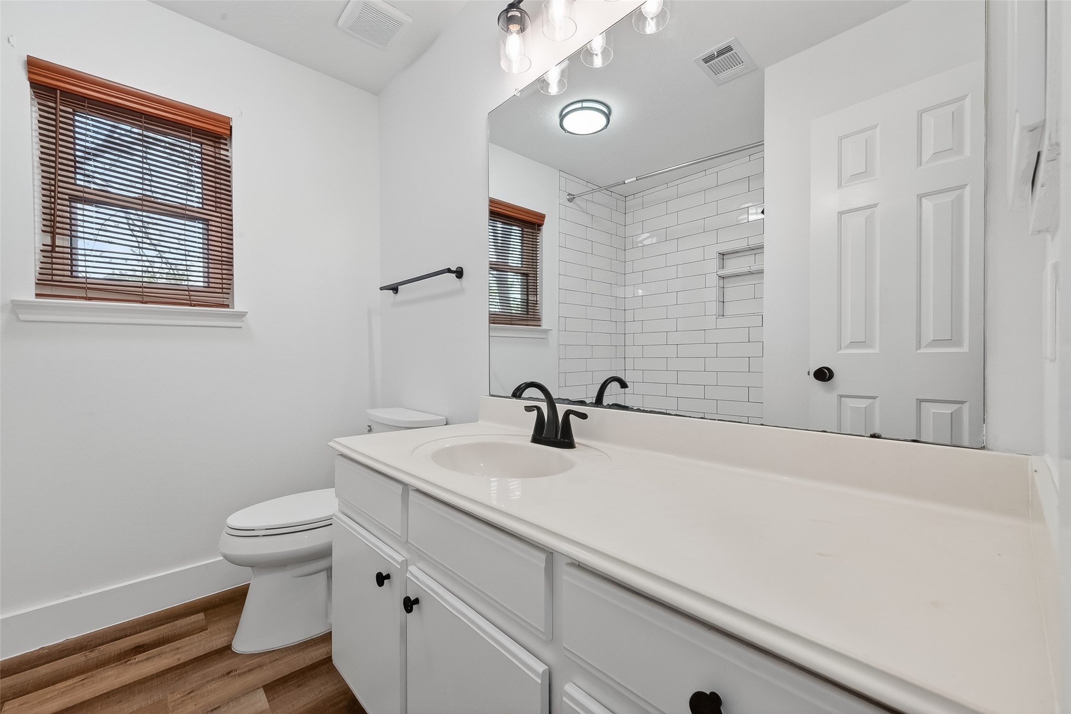 2018 Village Ct Lane Rosenberg, TX 77471 - Photo 34 of 50 a bathroom with a sink a toilet and a mirror