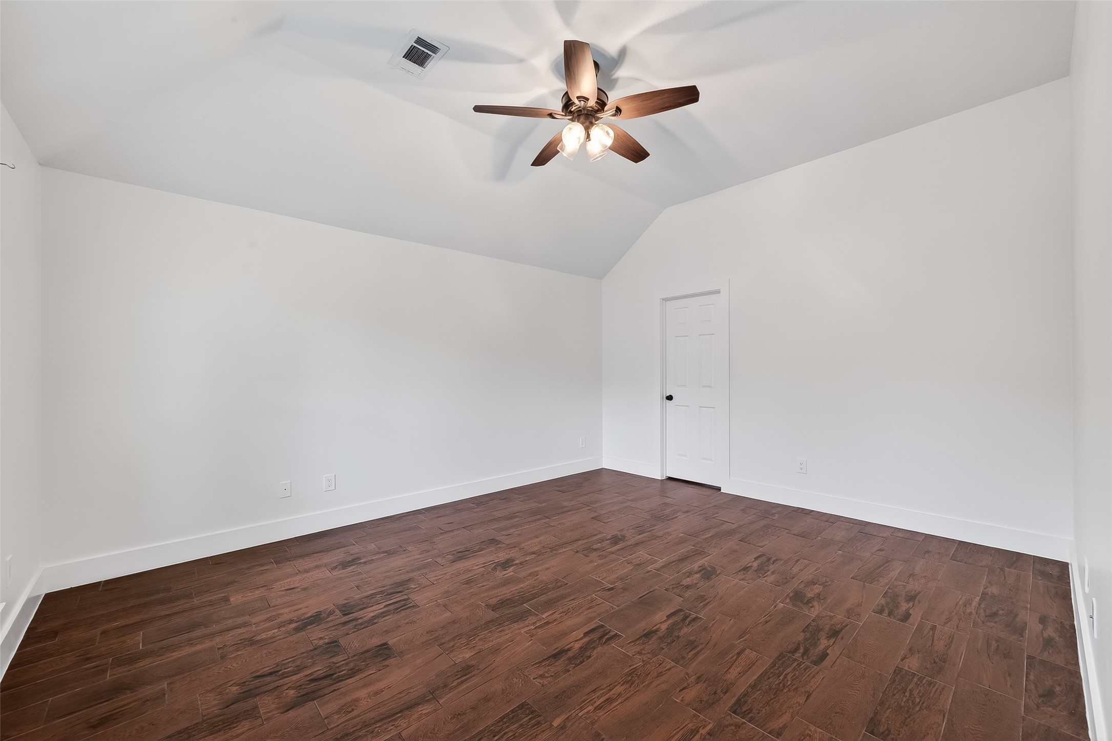2018 Village Ct Lane Rosenberg, TX 77471 - Photo 36 of 50 a view of a room with wooden floor and a ceiling fan