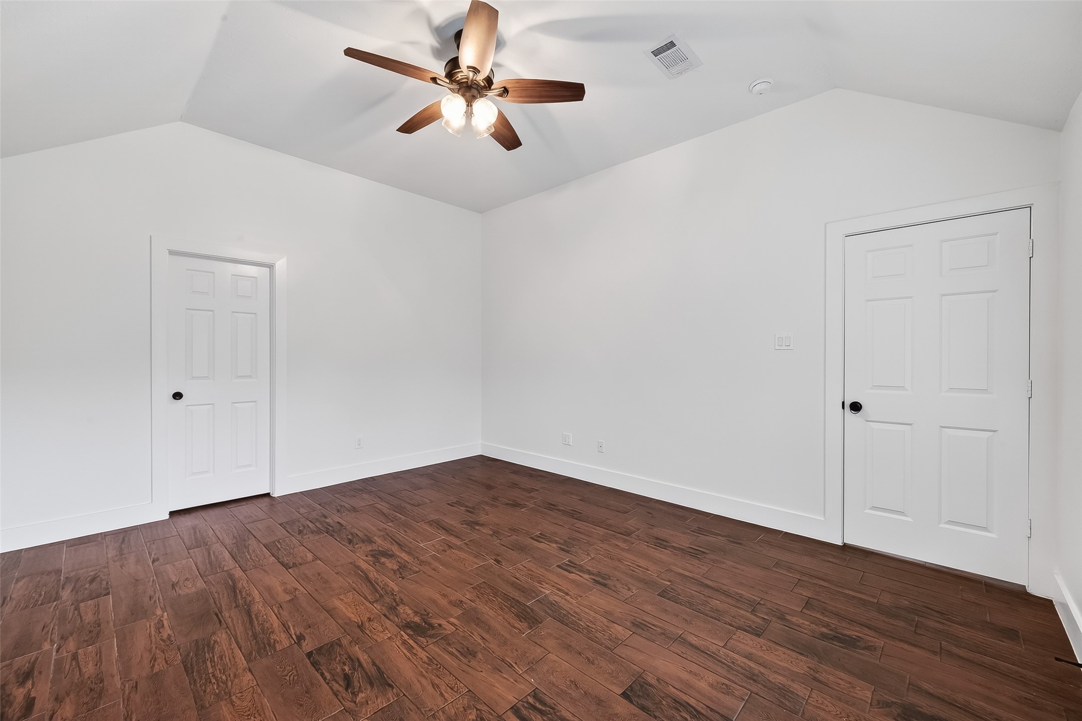2018 Village Ct Lane Rosenberg, TX 77471 - Photo 38 of 50 an empty room with wooden floor fan and windows