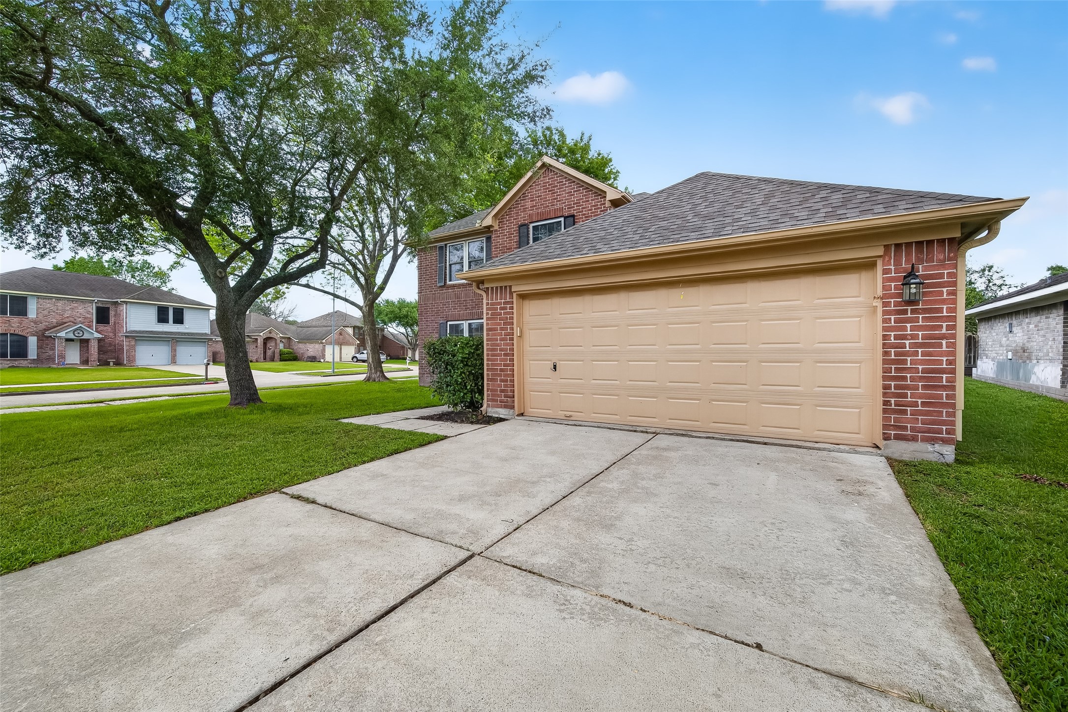 2018 Village Ct Lane Rosenberg, TX 77471 - Photo 4 of 50 a front view of a house with a yard and garage