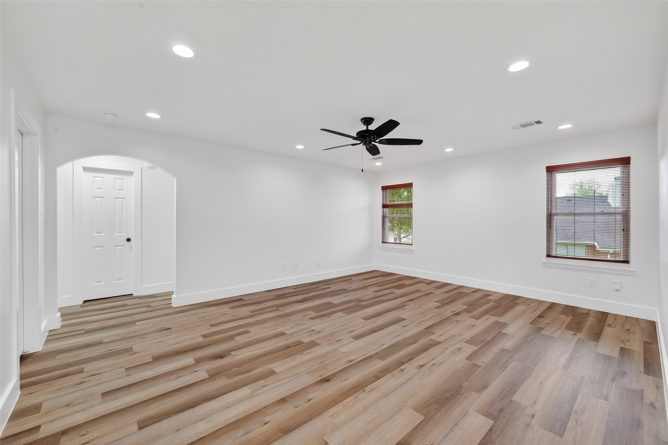 2018 Village Ct Lane Rosenberg, TX 77471 - Photo 42 of 50 a view of empty room with wooden floor and fan