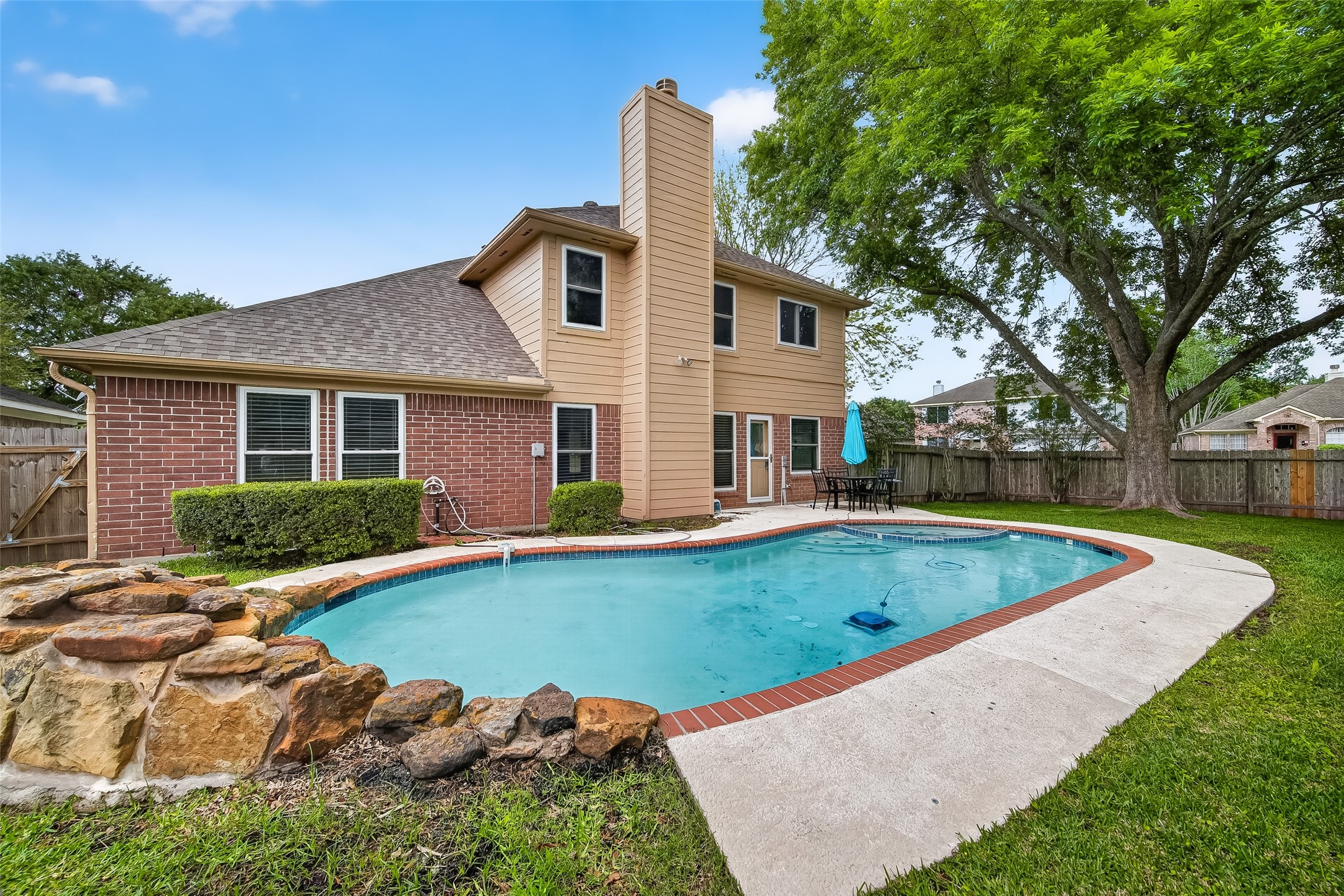 2018 Village Ct Lane Rosenberg, TX 77471 - Photo 47 of 50 a view of a house with swimming pool and a yard