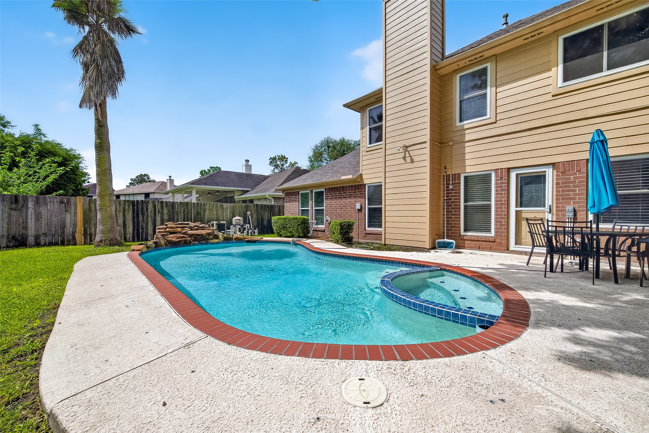 2018 Village Ct Lane Rosenberg, TX 77471 - Photo 49 of 50 a view of a house with swimming pool