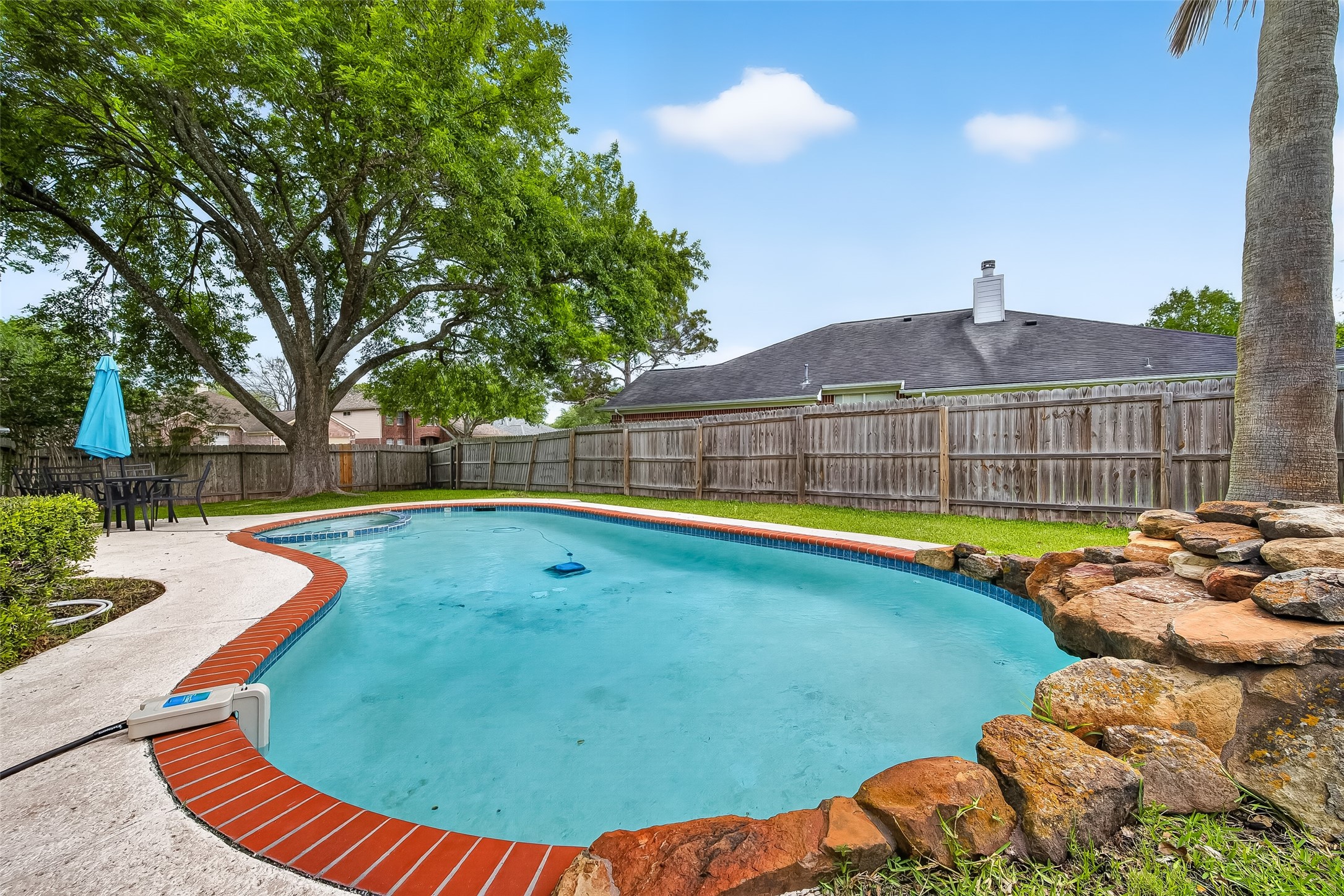 2018 Village Ct Lane Rosenberg, TX 77471 - Photo 50 of 50 a view of a swimming pool with a lounge chair