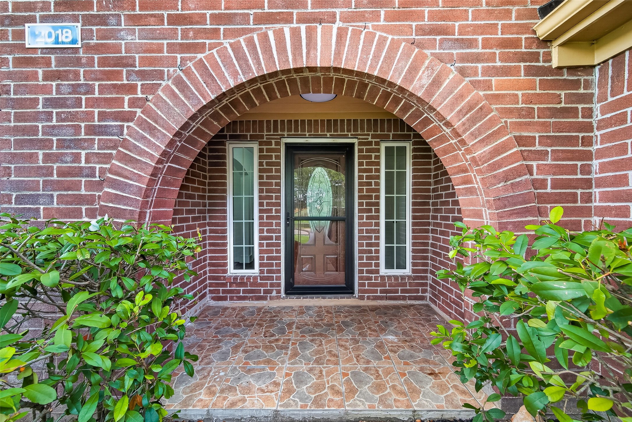 2018 Village Ct Lane Rosenberg, TX 77471 - Photo 6 of 50 a front view of a house with garden