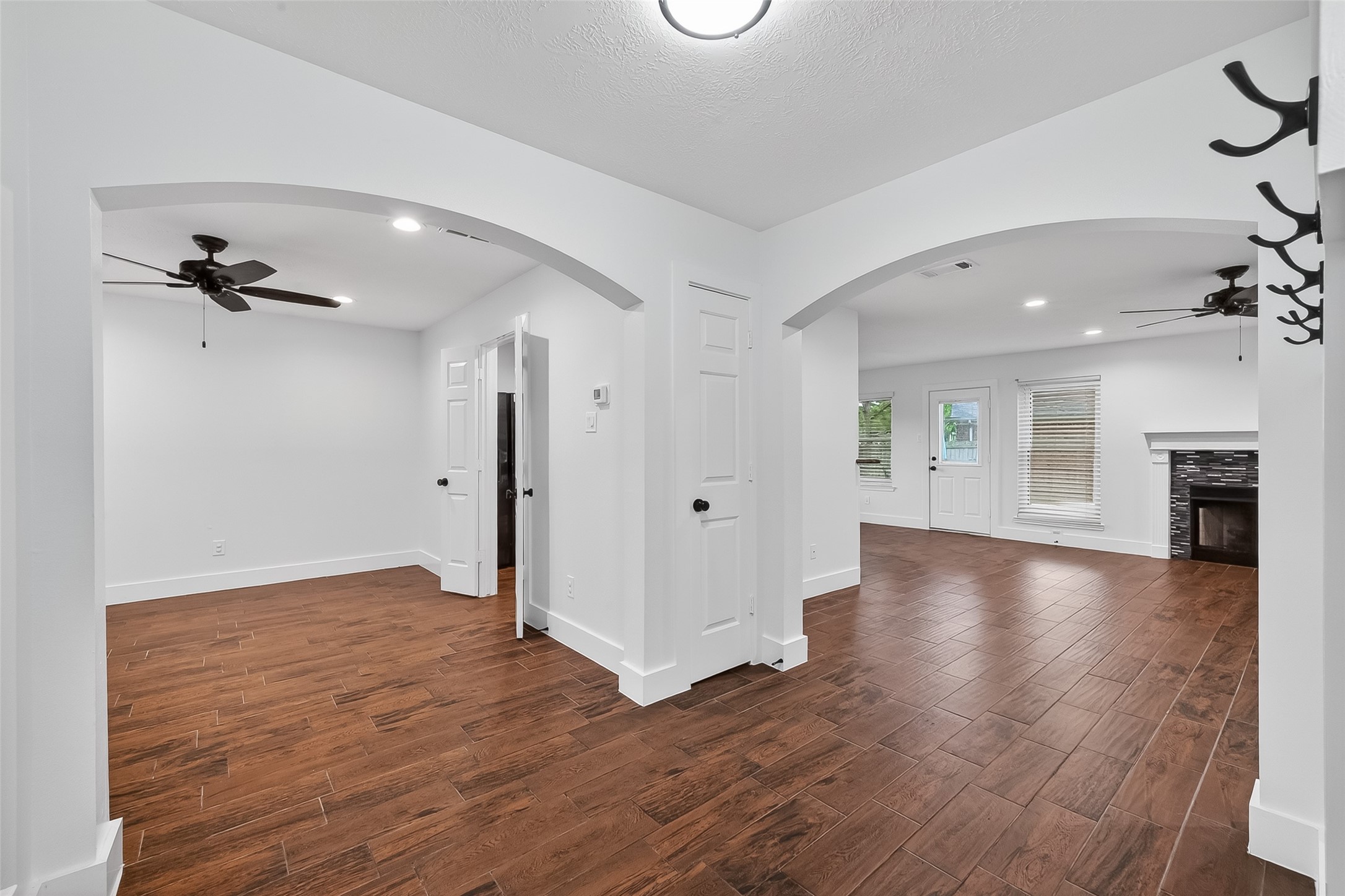 2018 Village Ct Lane Rosenberg, TX 77471 - Photo 8 of 50 an empty room with wooden floor and staircase