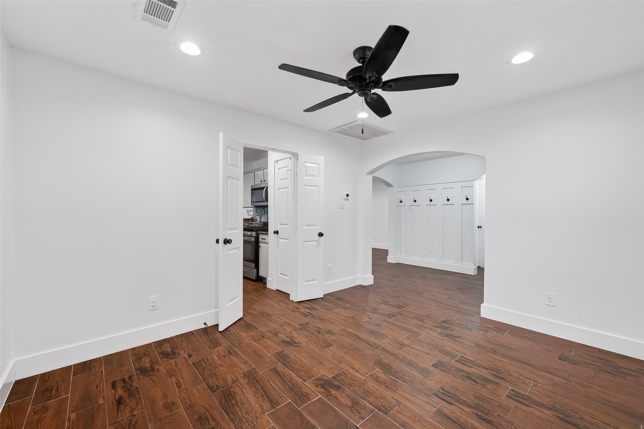 2018 Village Ct Lane Rosenberg, TX 77471 - Photo 10 of 50 an empty room with wooden floor and windows