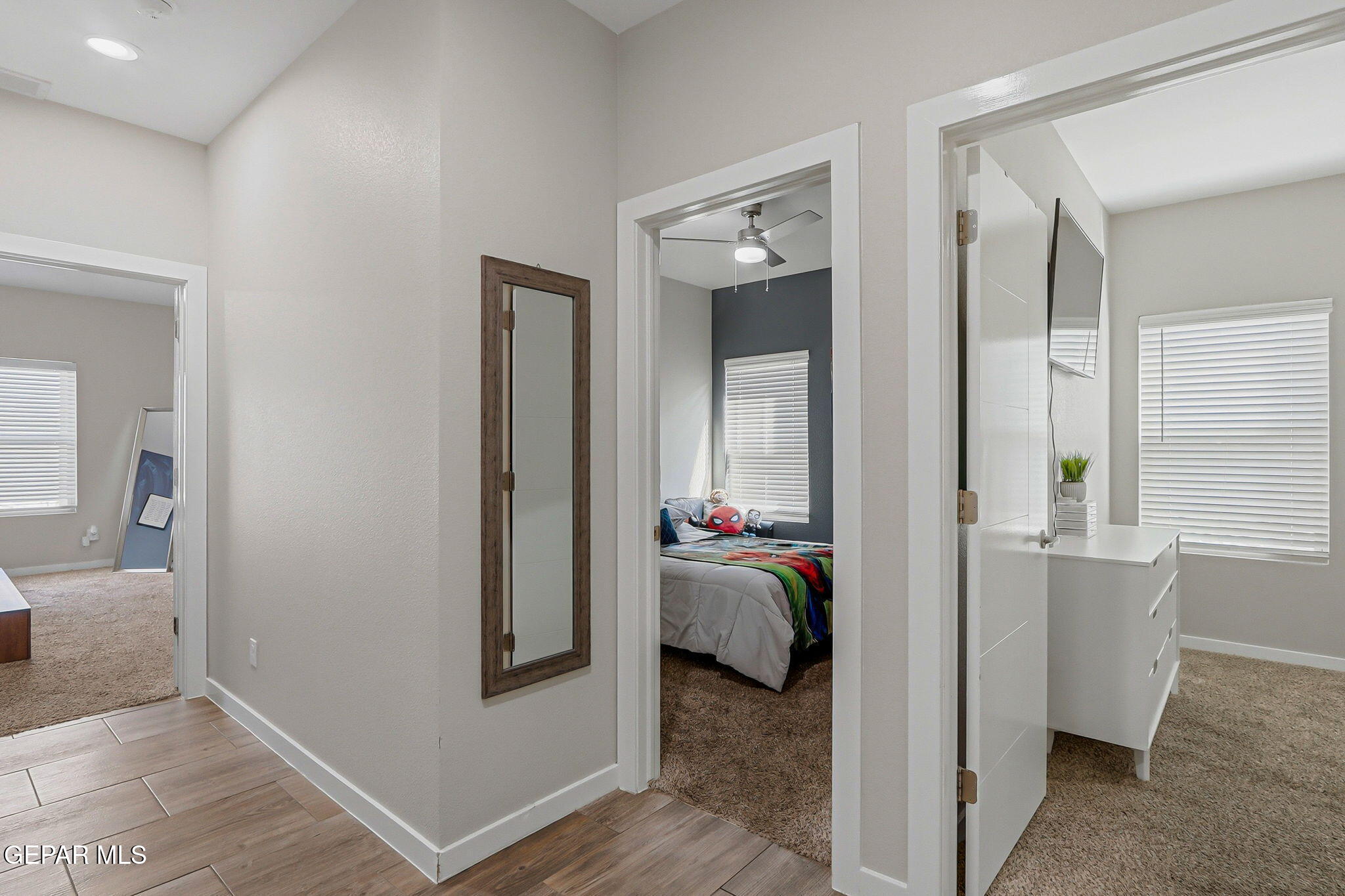 123 Via Rojas Drive Horizon City, TX 79928 - Photo 19 of 47 a view of a bedroom with a bed and glass door