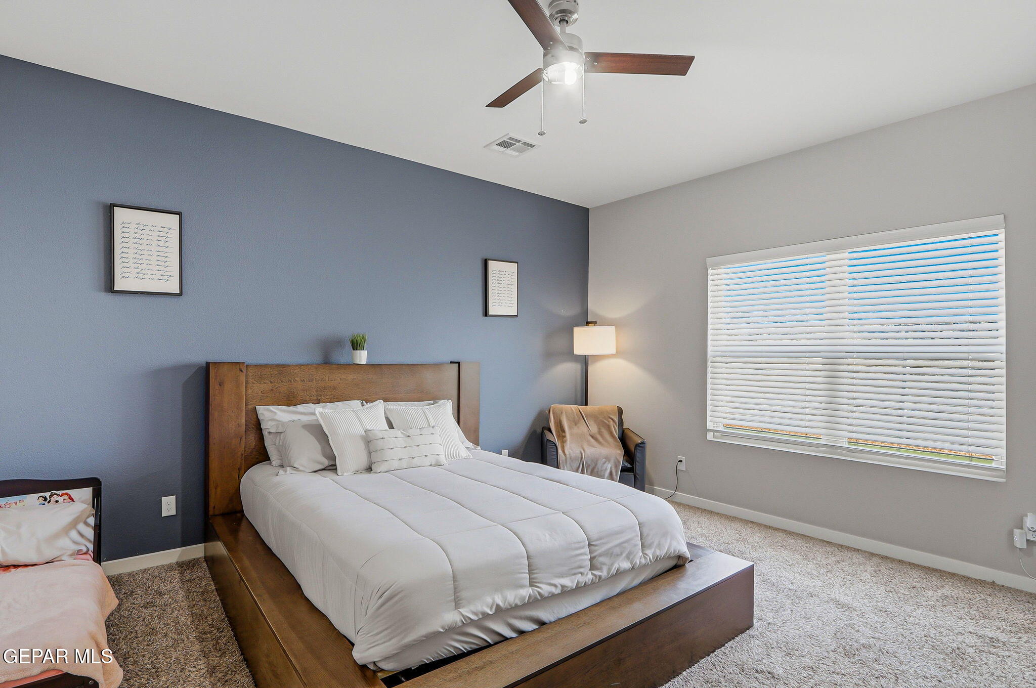 123 Via Rojas Drive Horizon City, TX 79928 - Photo 20 of 47 a bedroom with a bed and a window