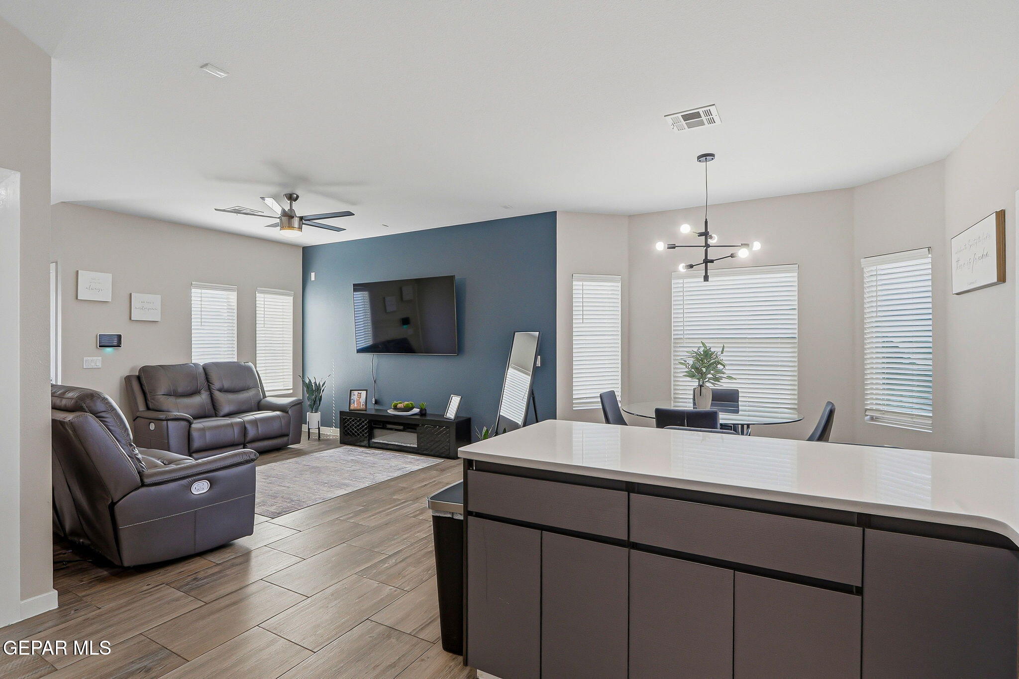 123 Via Rojas Drive Horizon City, TX 79928 - Photo 2 of 47 a living room with furniture and a flat screen tv