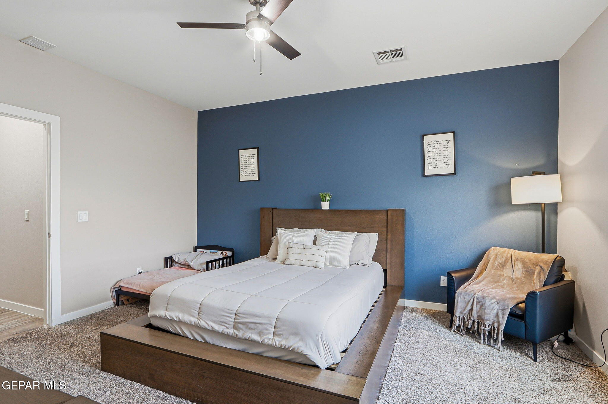 123 Via Rojas Drive Horizon City, TX 79928 - Photo 21 of 47 a bedroom with a bed and a ceiling fan