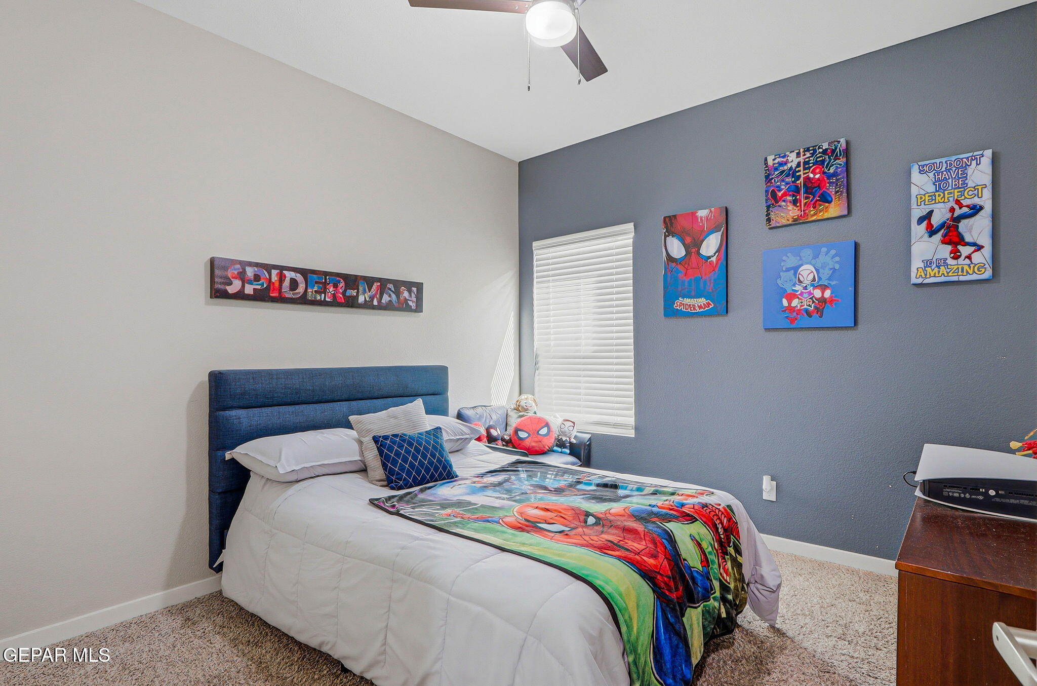 123 Via Rojas Drive Horizon City, TX 79928 - Photo 27 of 47 a bedroom with a bed and a chandelier