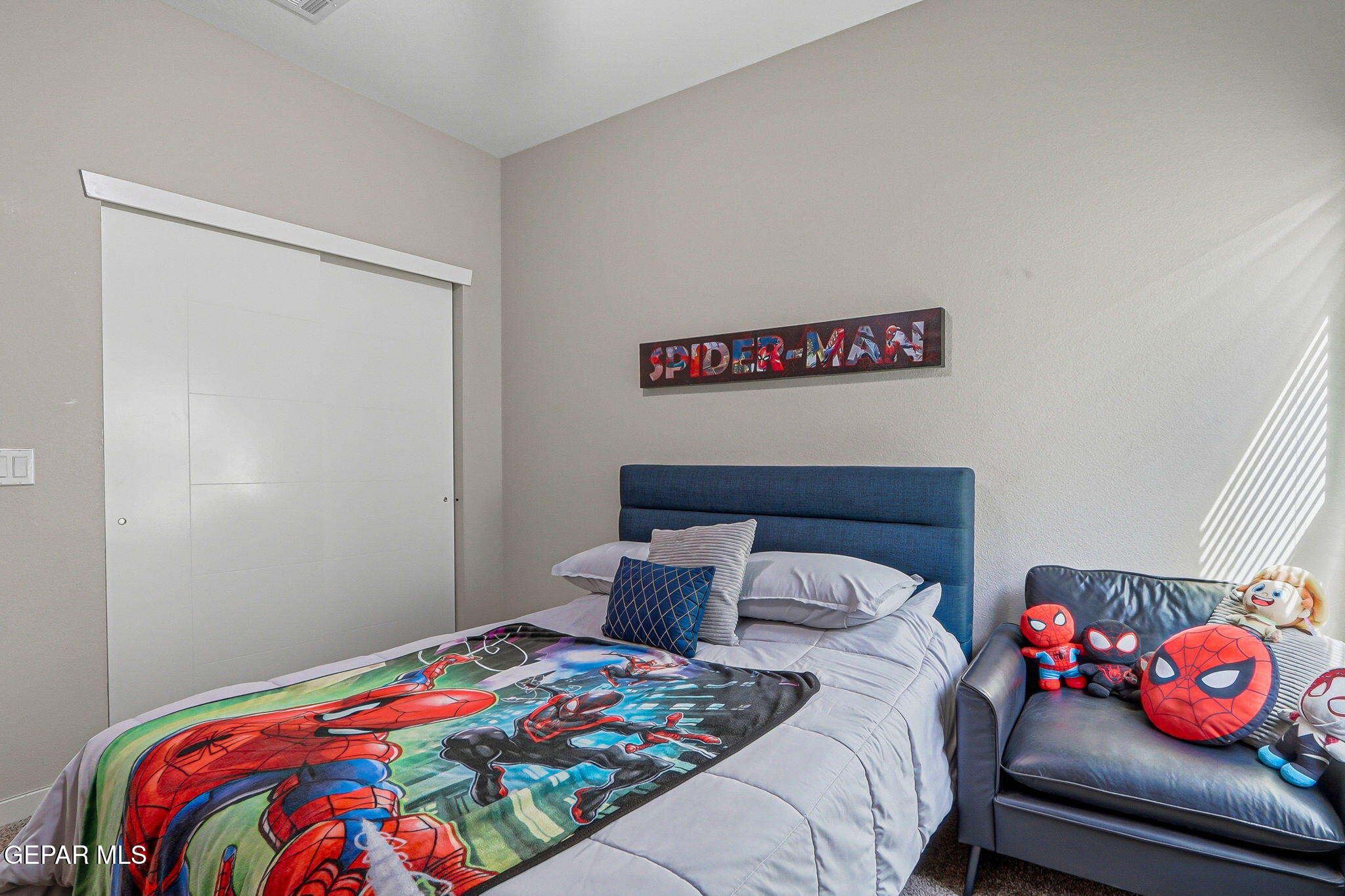 123 Via Rojas Drive Horizon City, TX 79928 - Photo 28 of 47 a bedroom with a bed and wooden floor