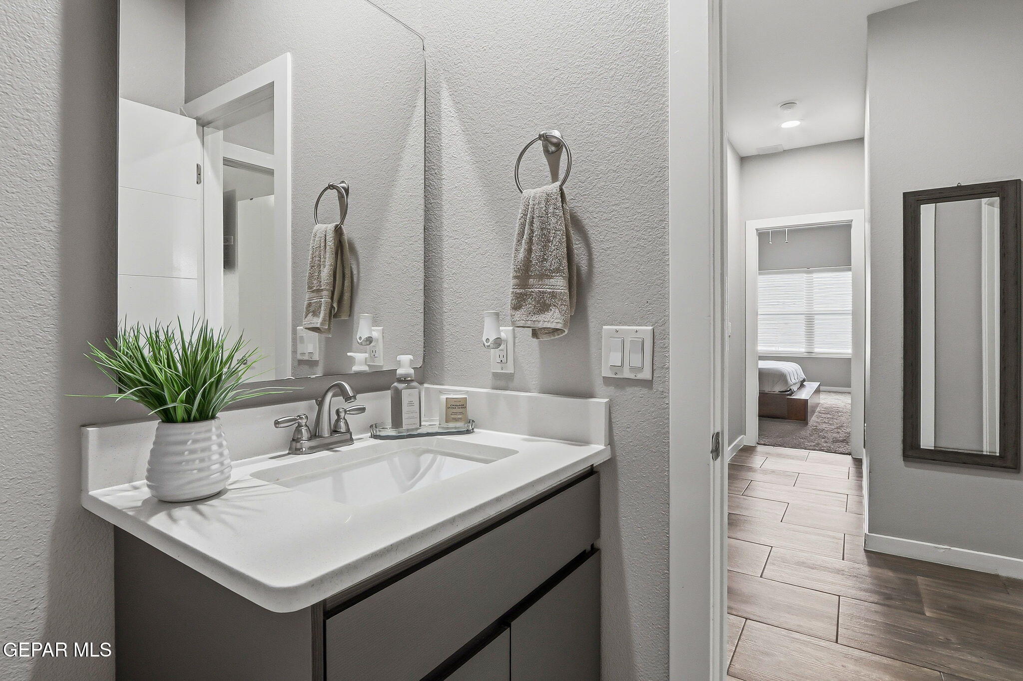 123 Via Rojas Drive Horizon City, TX 79928 - Photo 30 of 47 a bathroom with a sink and a mirror
