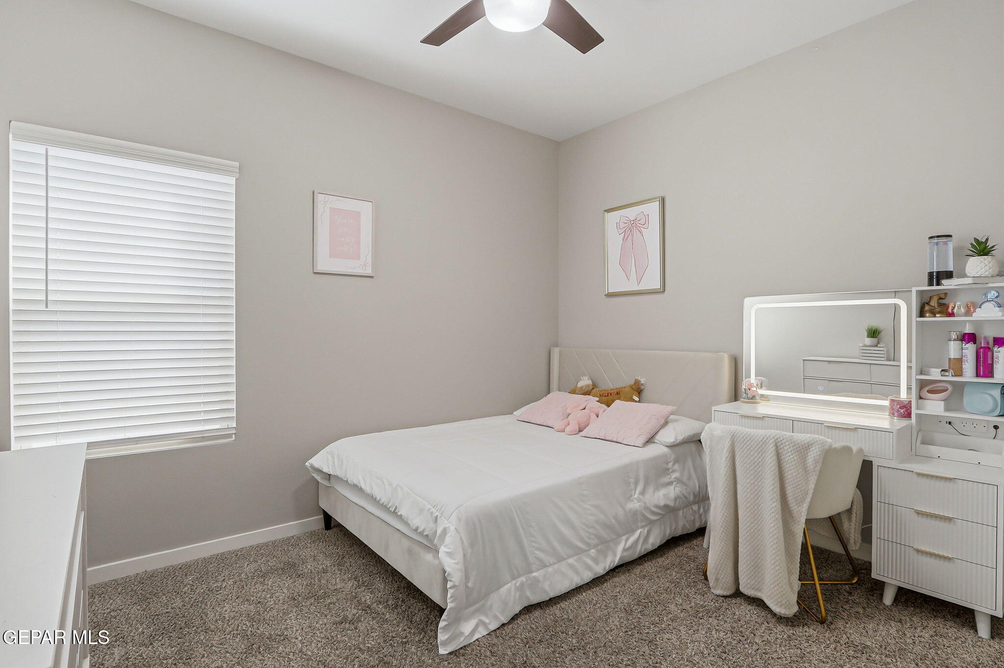 123 Via Rojas Drive Horizon City, TX 79928 - Photo 31 of 47 a bedroom with a bed and a window