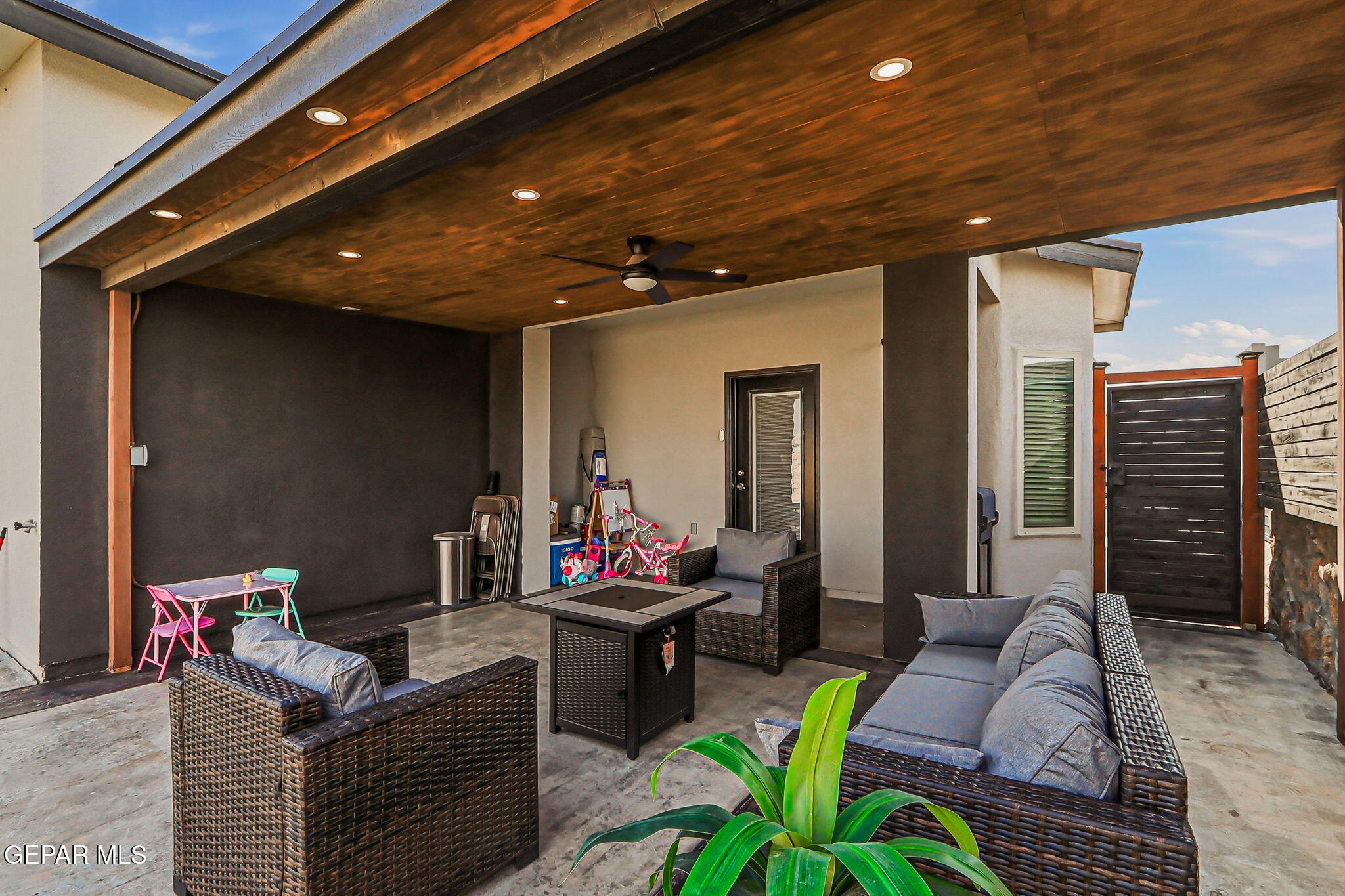 123 Via Rojas Drive Horizon City, TX 79928 - Photo 36 of 47 a outdoor living space with furniture and a fireplace