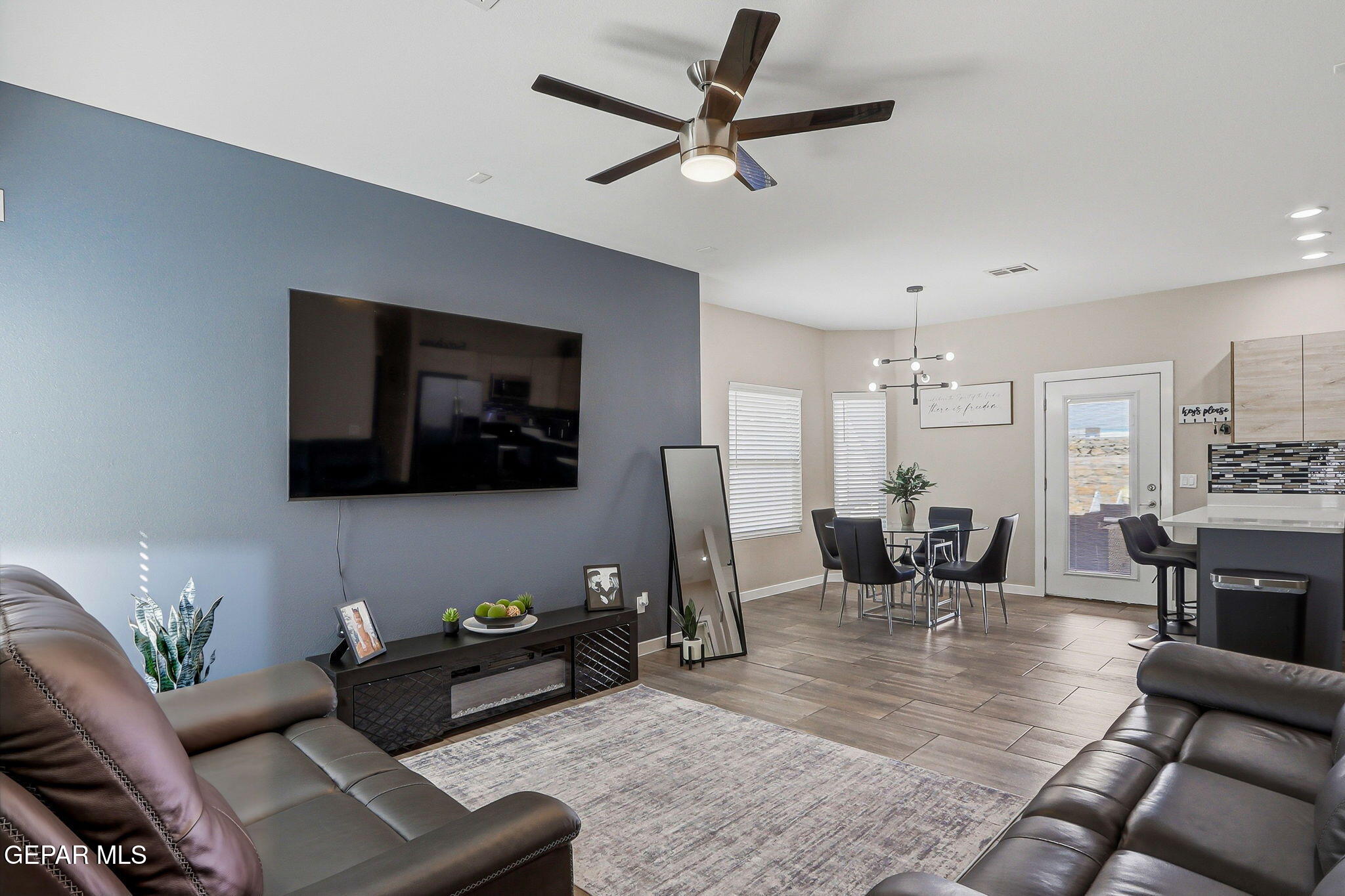123 Via Rojas Drive Horizon City, TX 79928 - Photo 7 of 47 a living room with furniture and a flat screen tv