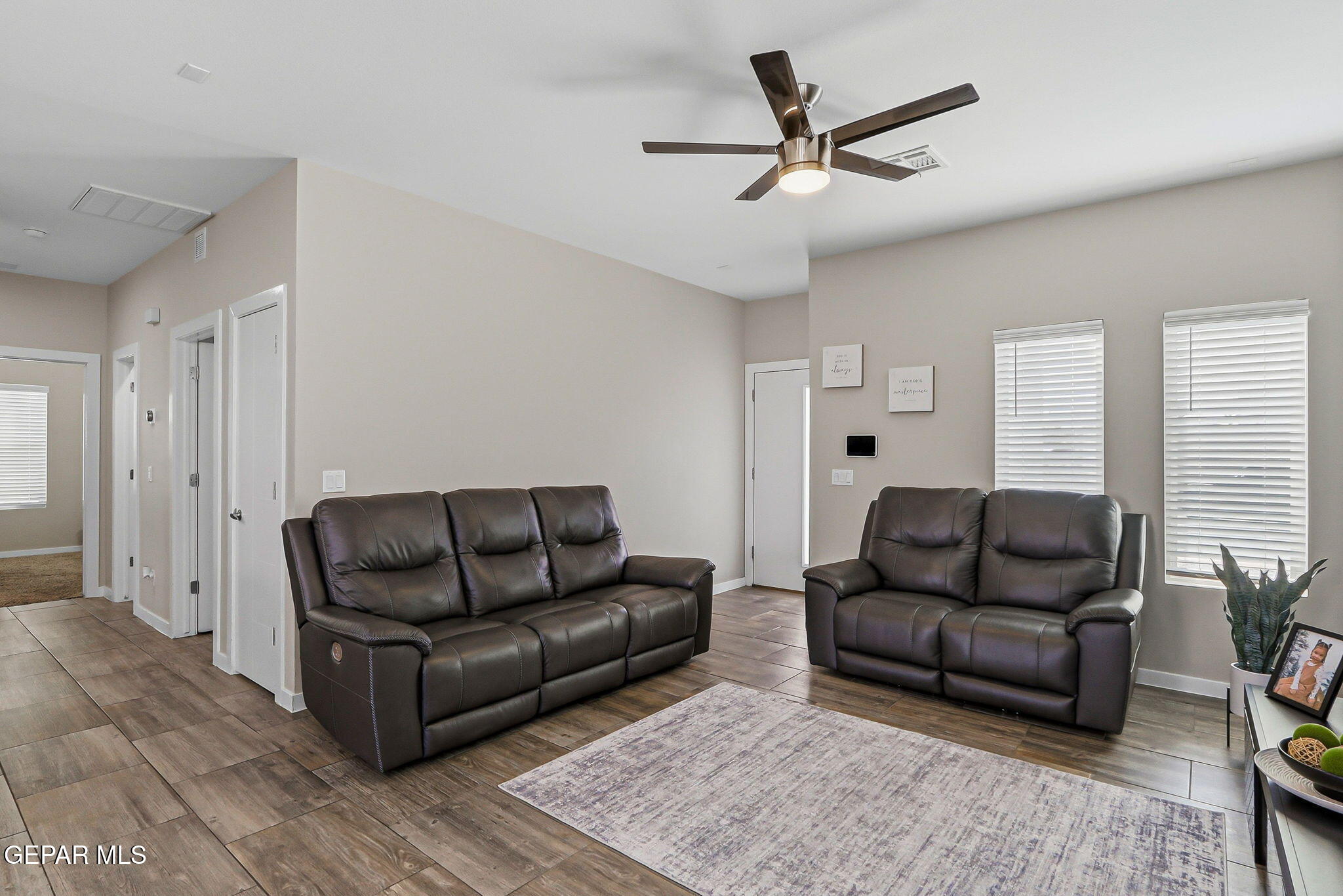 123 Via Rojas Drive Horizon City, TX 79928 - Photo 9 of 47 a living room with furniture and a ceiling fan