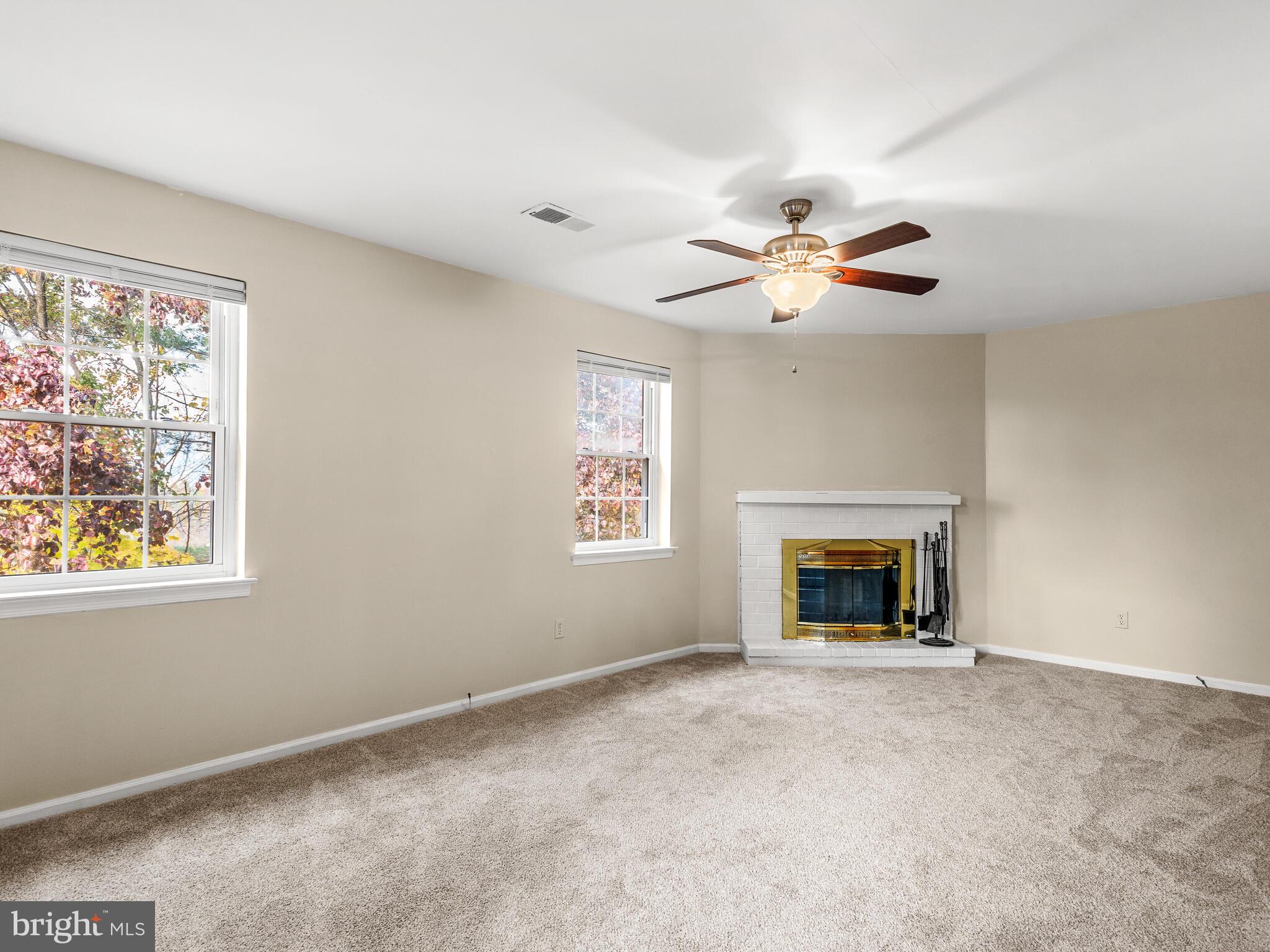 222 Llandovery Drive Exton, PA 19341 - Photo 14 of 32 Family room with new carpet and fireplace