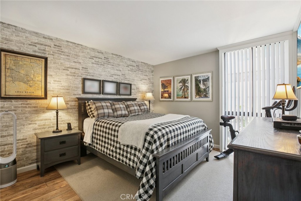 1750 East Ocean Boulevard, Unit 102 Long Beach, CA 90802 - Photo 7 of 22 a bed room with a bed and a couch