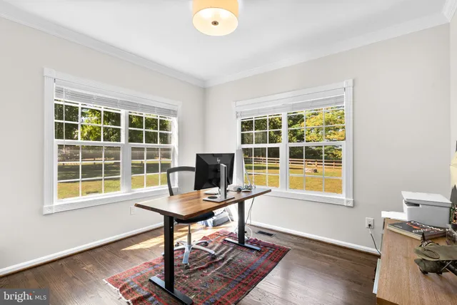 a workspace with furniture and a window