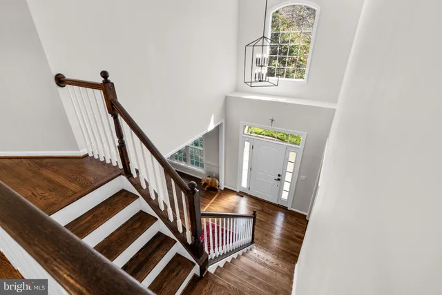 a view of an entryway with wooden floor