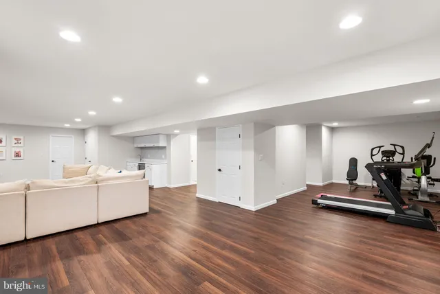 a view of a room with wooden floor