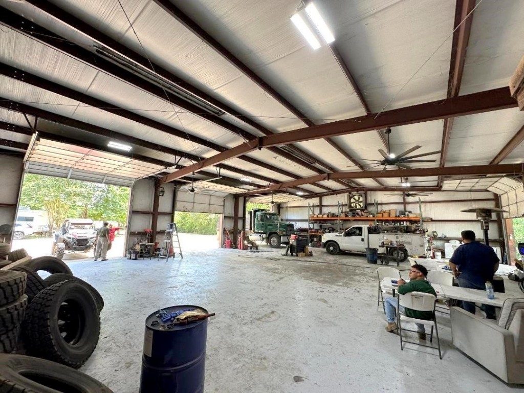 25920 Grand Pines Road Magnolia, TX 77355 - Photo 5 of 16 a view of parking garage with cars