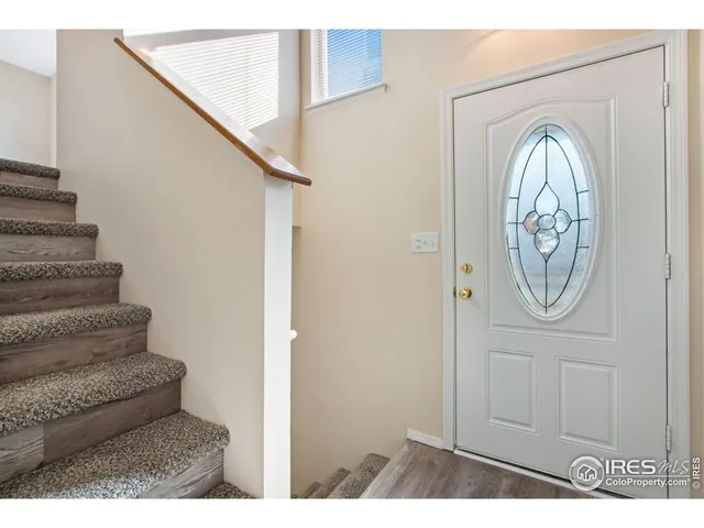 a view of entryway with wooden floor
