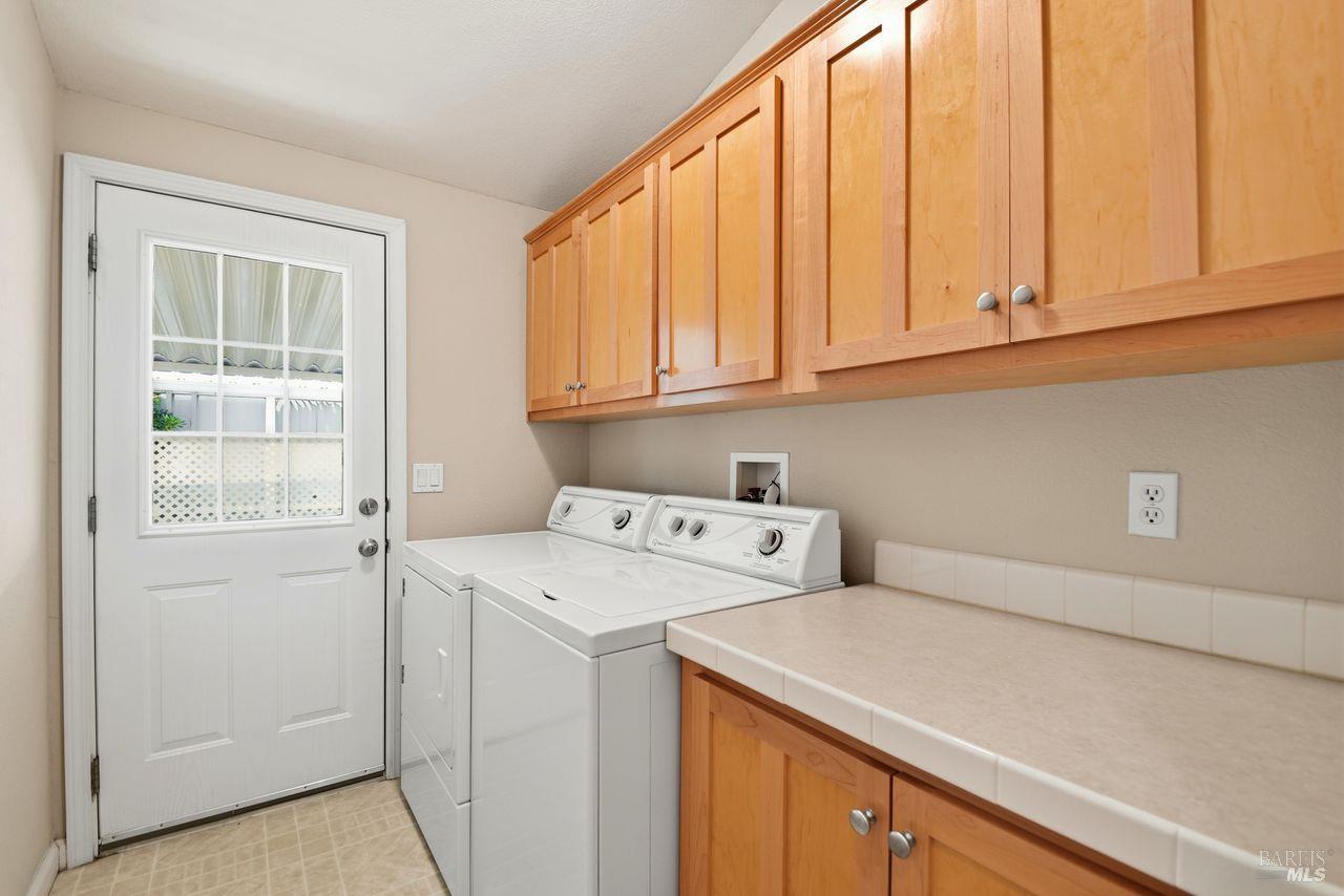 121 Coronado Circle Santa Rosa, CA 95409 - Photo 24 of 32 a utility room with dryer and washer