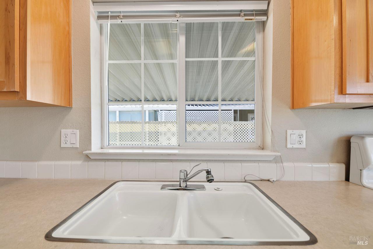121 Coronado Circle Santa Rosa, CA 95409 - Photo 10 of 32 a bathroom with a sink and a window