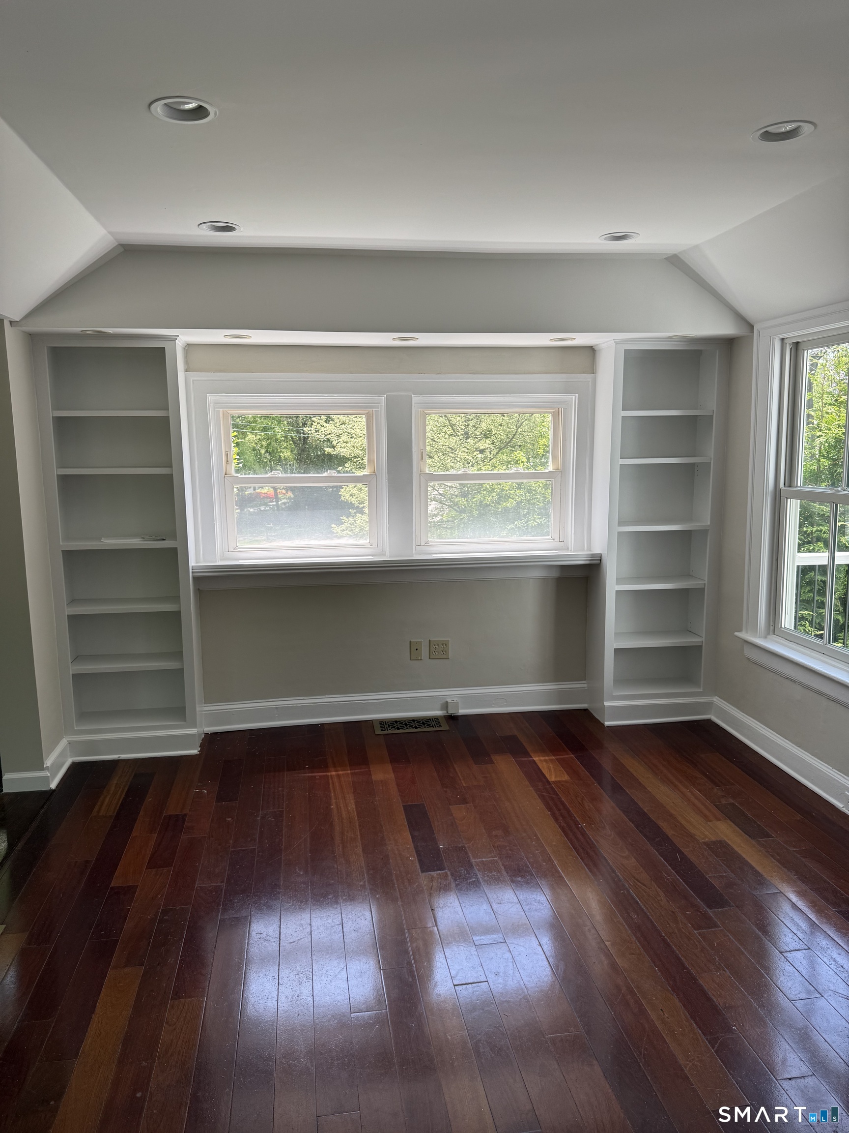 312 Ferry Road Old Lyme, CT 06371 - Photo 4 of 16 an empty room with wooden floor closet and windows