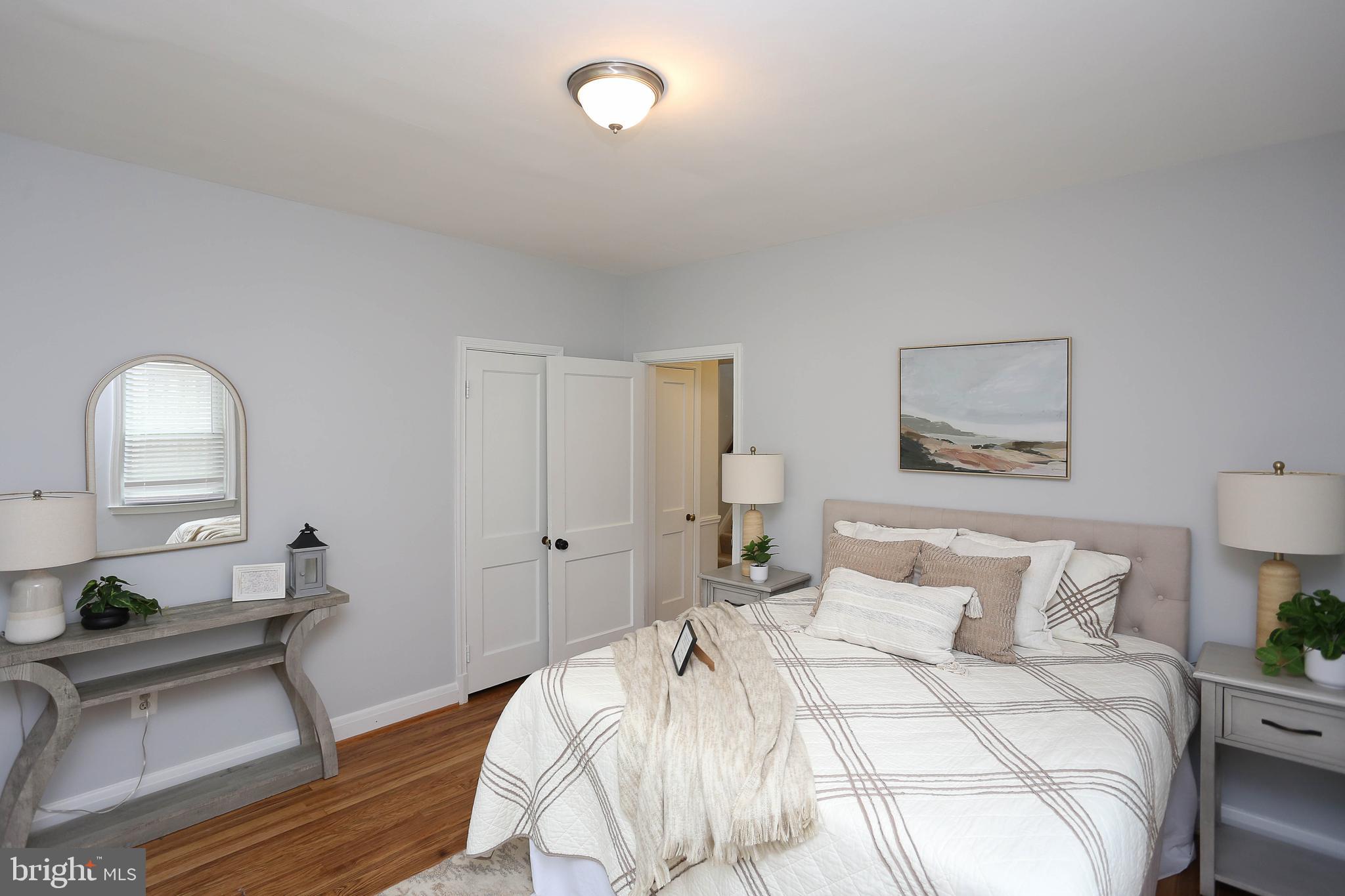 409 South Wickham Road Baltimore, MD 21229 - Photo 14 of 48 Main floor Primary BDRM w/hardwood floors & fresh