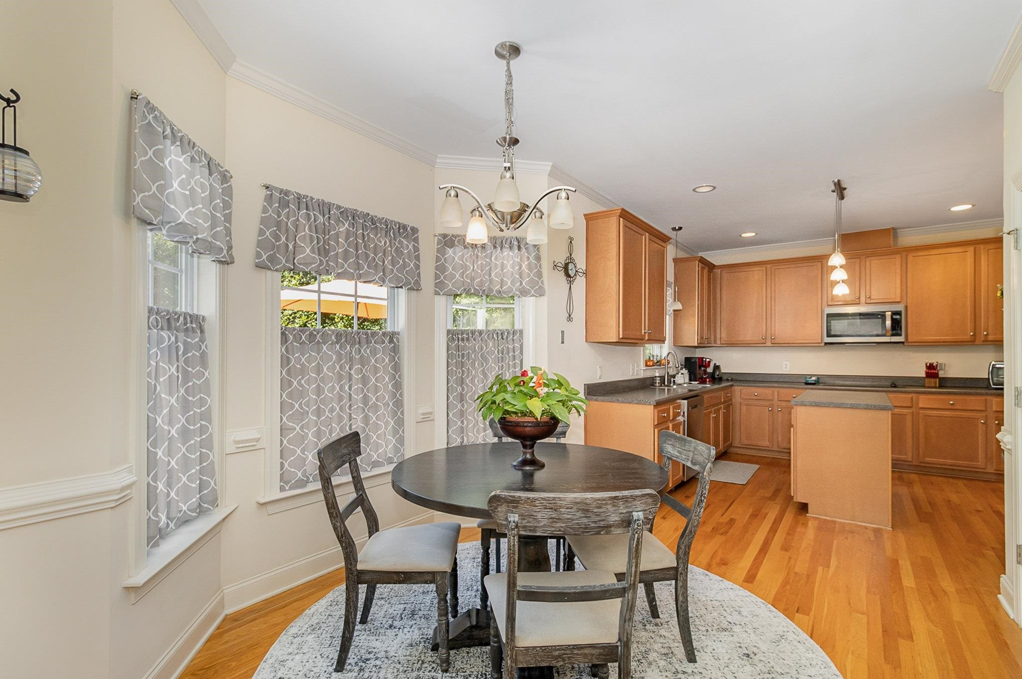 226 Keller Drive Clayton, NC 27520 - Photo 11 of 30 a view of a dining room with furniture window and wooden floor