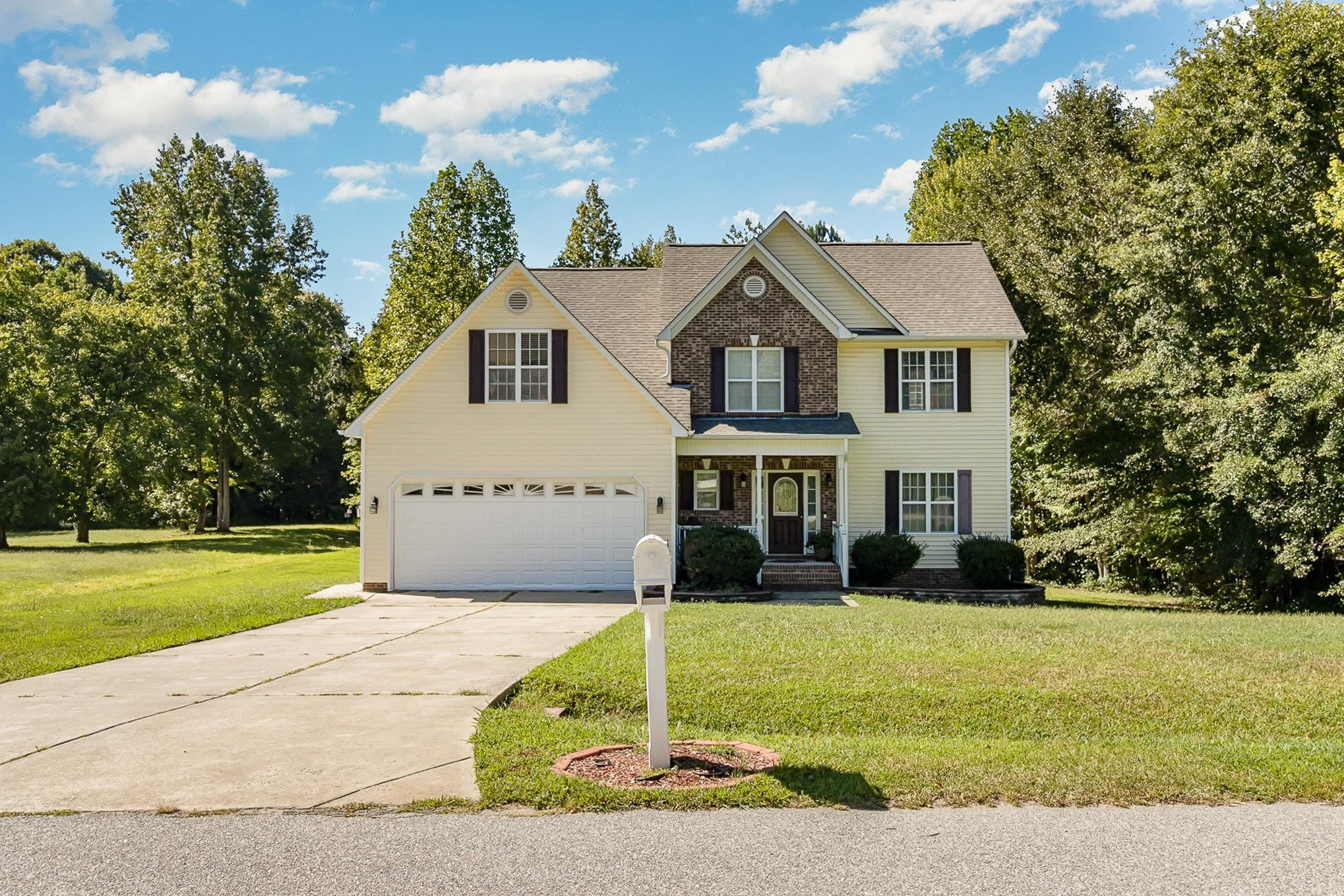 226 Keller Drive Clayton, NC 27520 - Photo 2 of 30 a house that has a tree in front of it