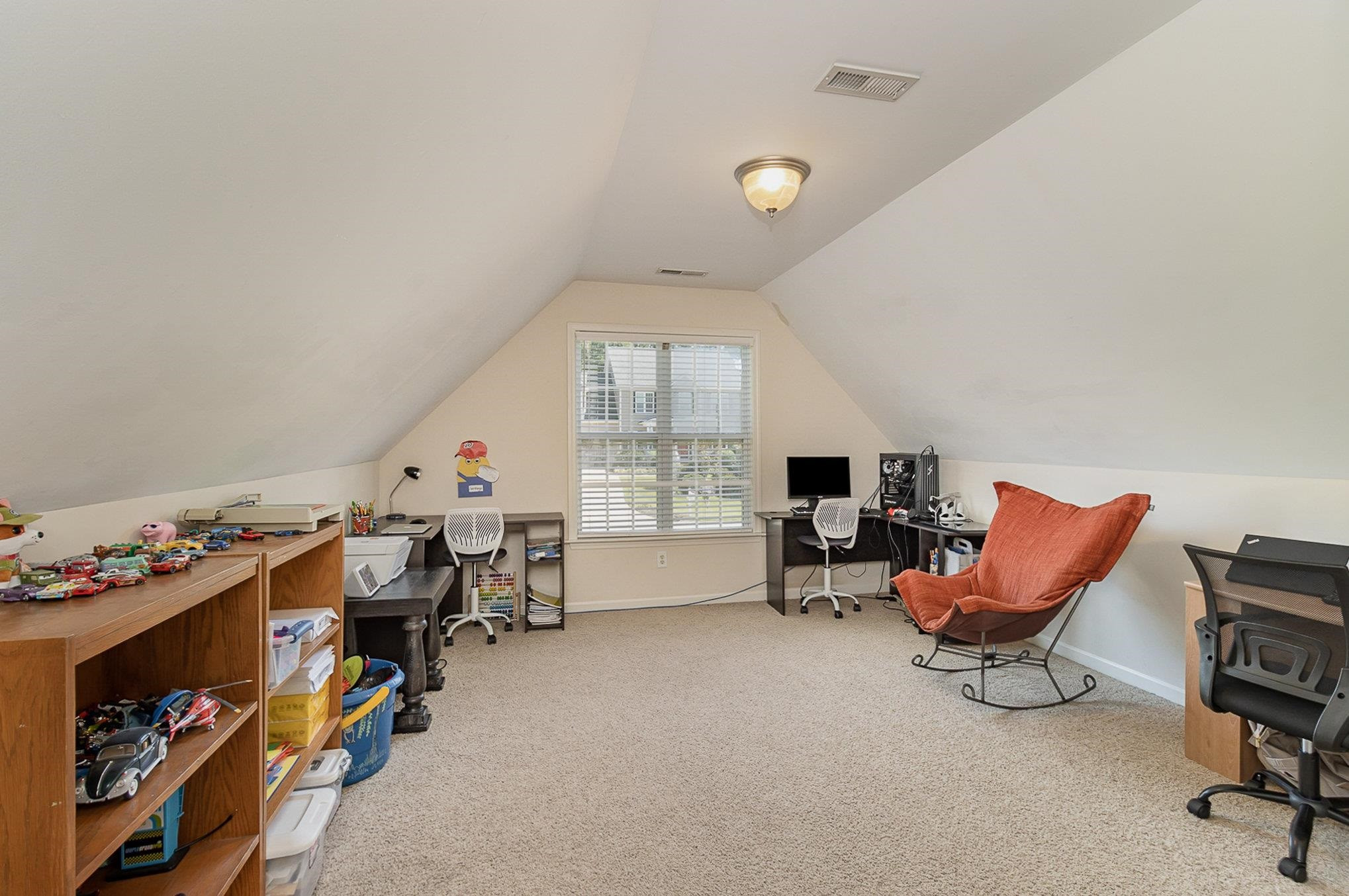 226 Keller Drive Clayton, NC 27520 - Photo 23 of 30 a living room with furniture and a flat screen tv