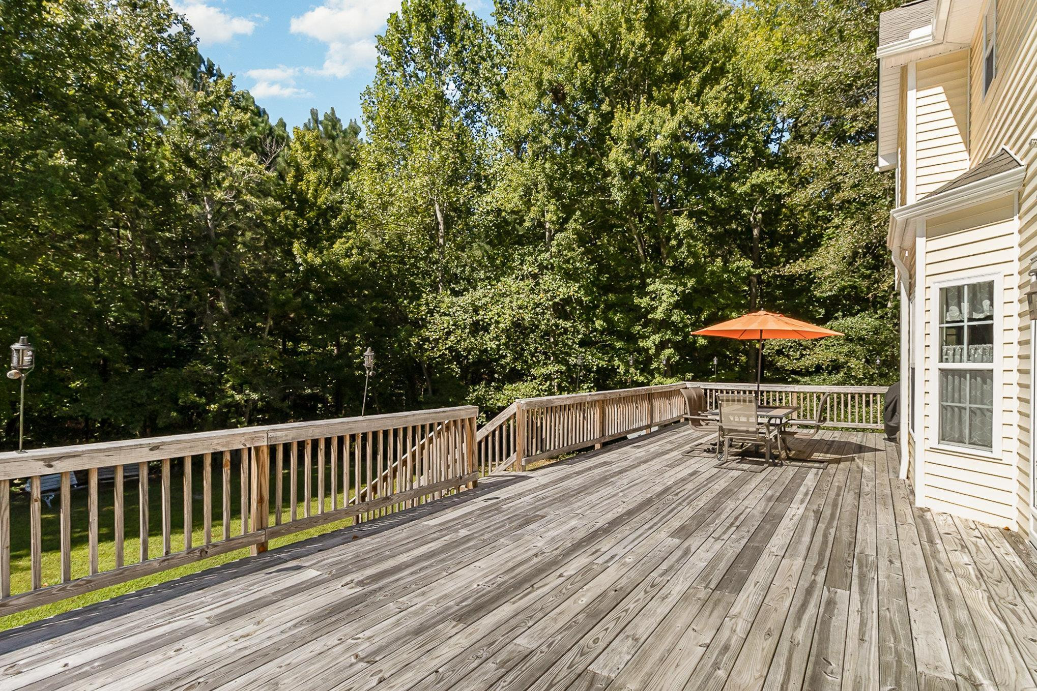 226 Keller Drive Clayton, NC 27520 - Photo 25 of 30 a view of balcony with deck and wooden floor