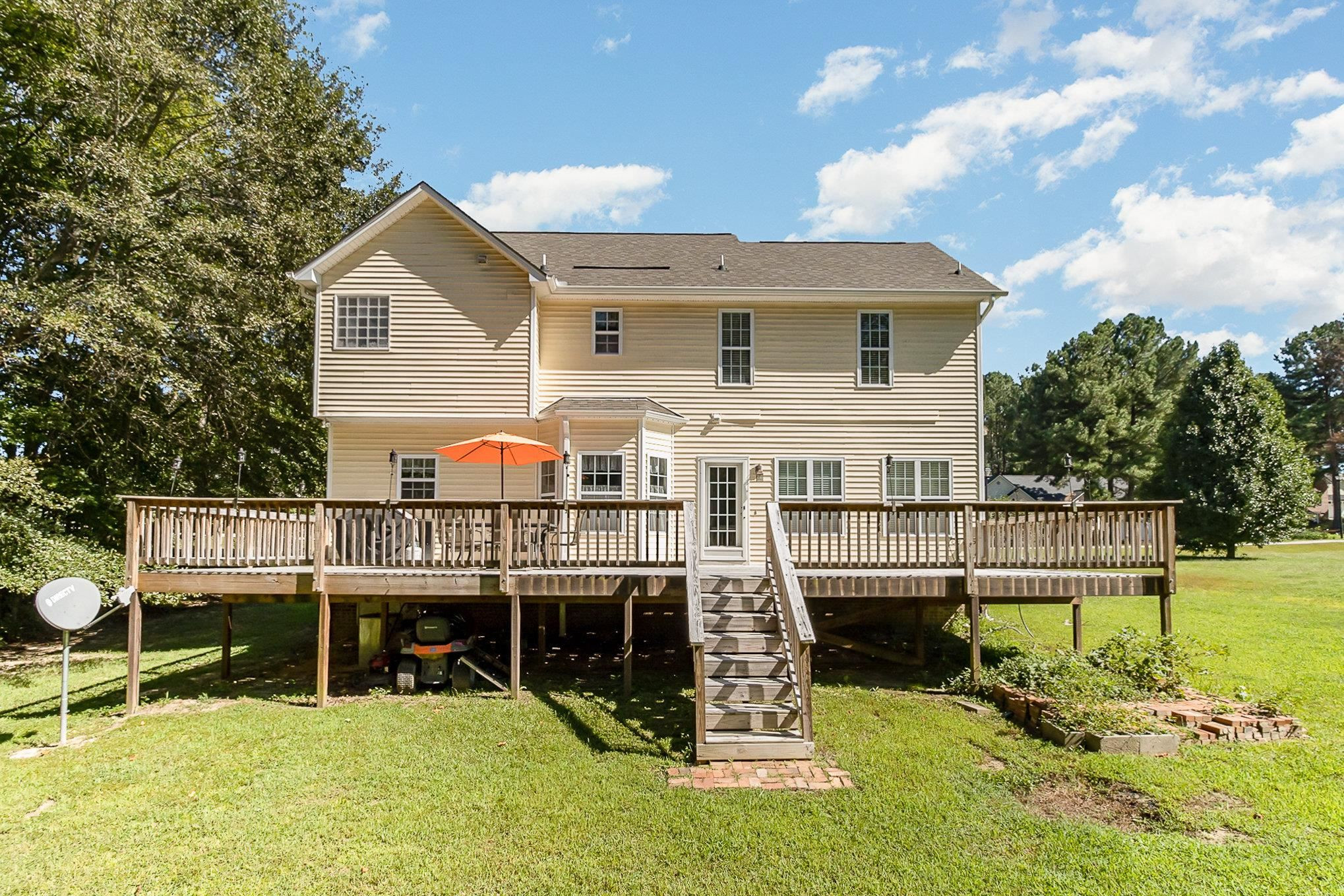 226 Keller Drive Clayton, NC 27520 - Photo 26 of 30 a view of house with a swimming pool and sitting area