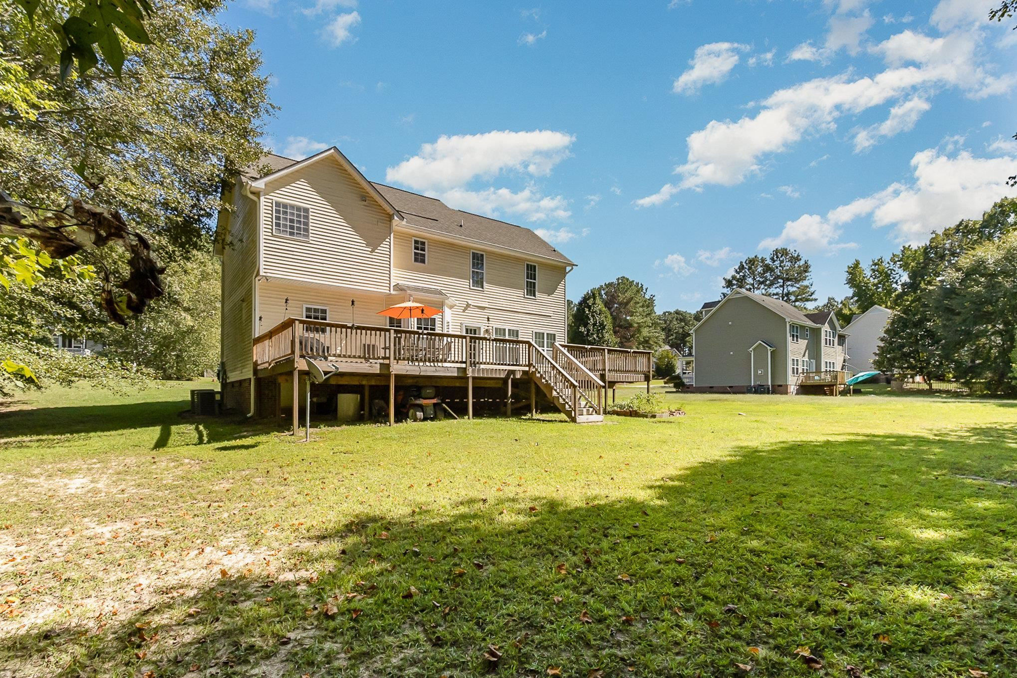 226 Keller Drive Clayton, NC 27520 - Photo 28 of 30 a view of a house with a yard and sitting area