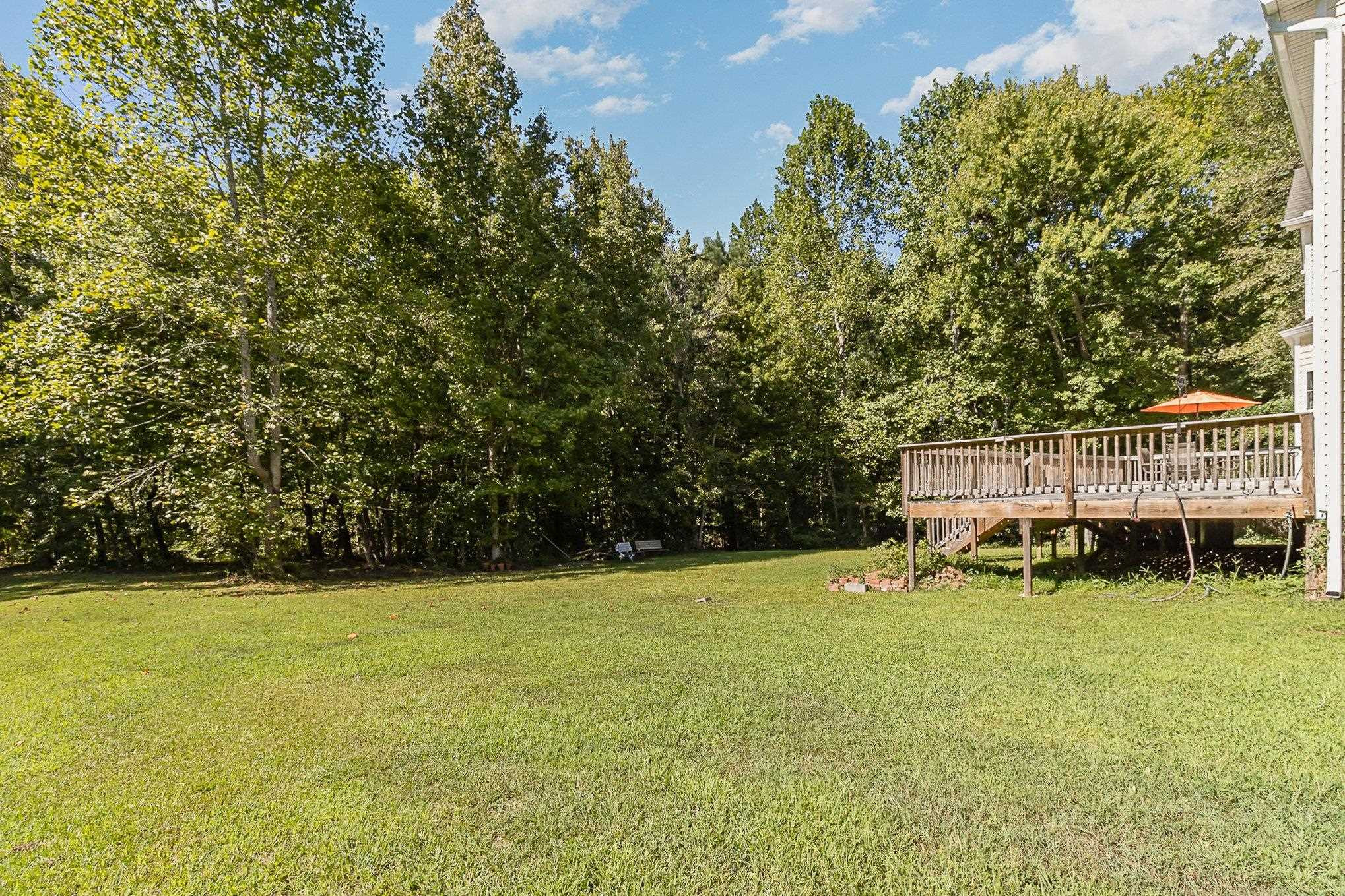 226 Keller Drive Clayton, NC 27520 - Photo 30 of 30 a view of a house with a yard and sitting area