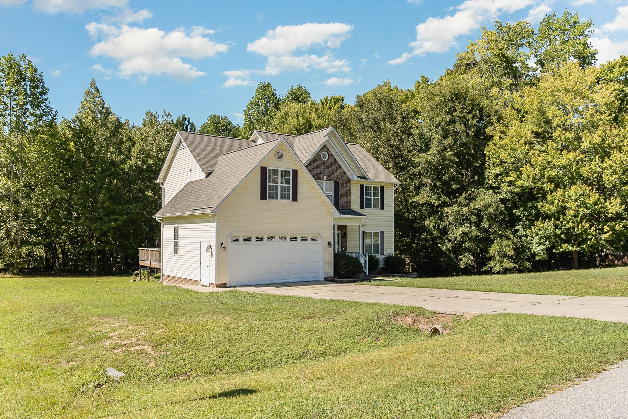 226 Keller Drive Clayton, NC 27520 - Photo 4 of 30 a front view of a house with yard