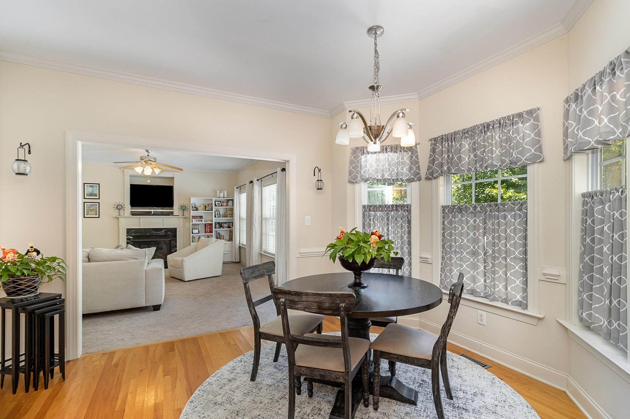 226 Keller Drive Clayton, NC 27520 - Photo 8 of 30 a dining room with furniture a chandelier and wooden floor