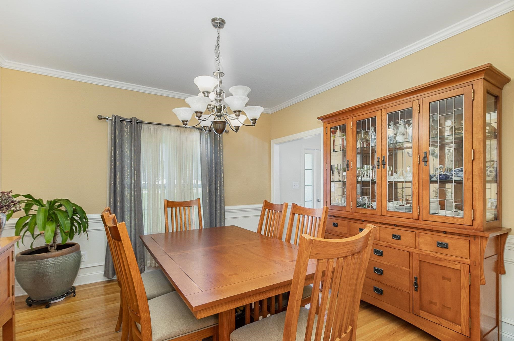 226 Keller Drive Clayton, NC 27520 - Photo 10 of 30 a view of a dining room with furniture window and wooden floor